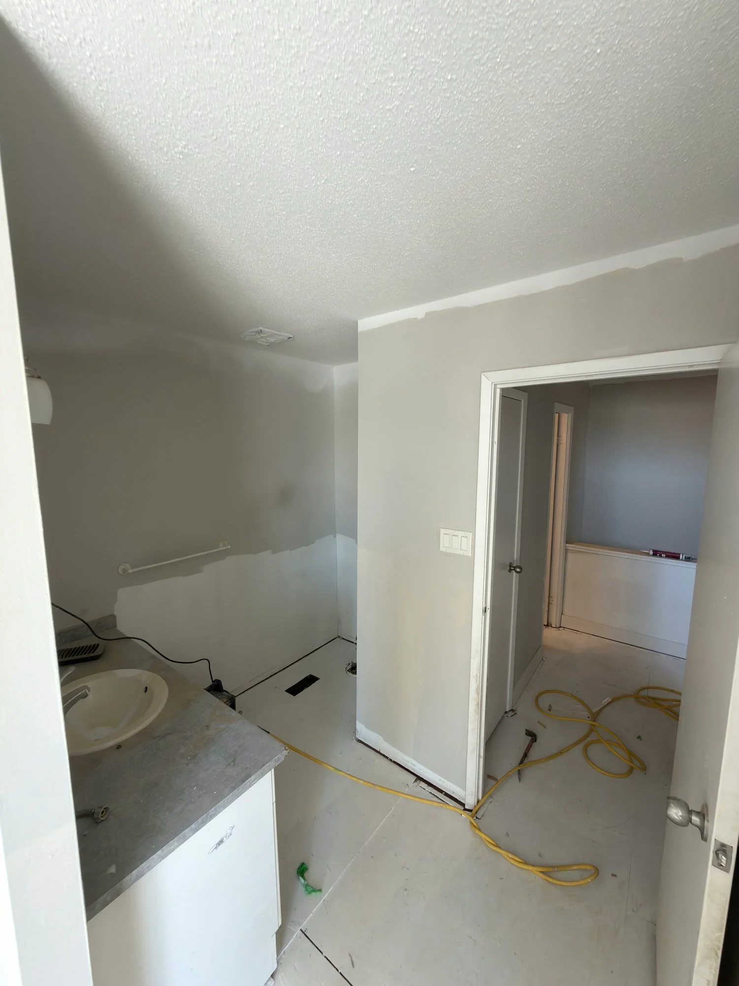 unit-bare-subfloor-partial-kitchen-hallway-london-ontario-01.jpg