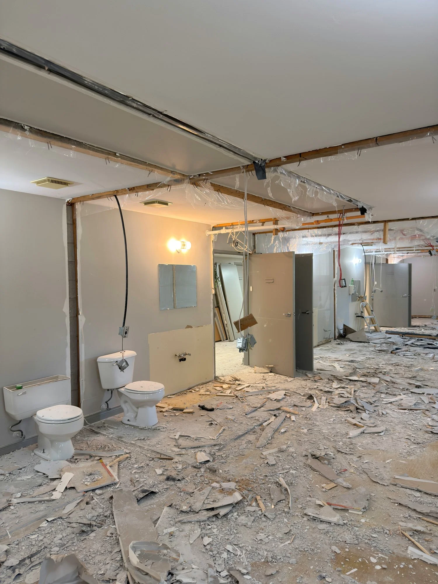 bathroom-gutted-toilets-drywall-debris-chatham-ontario-01.jpg