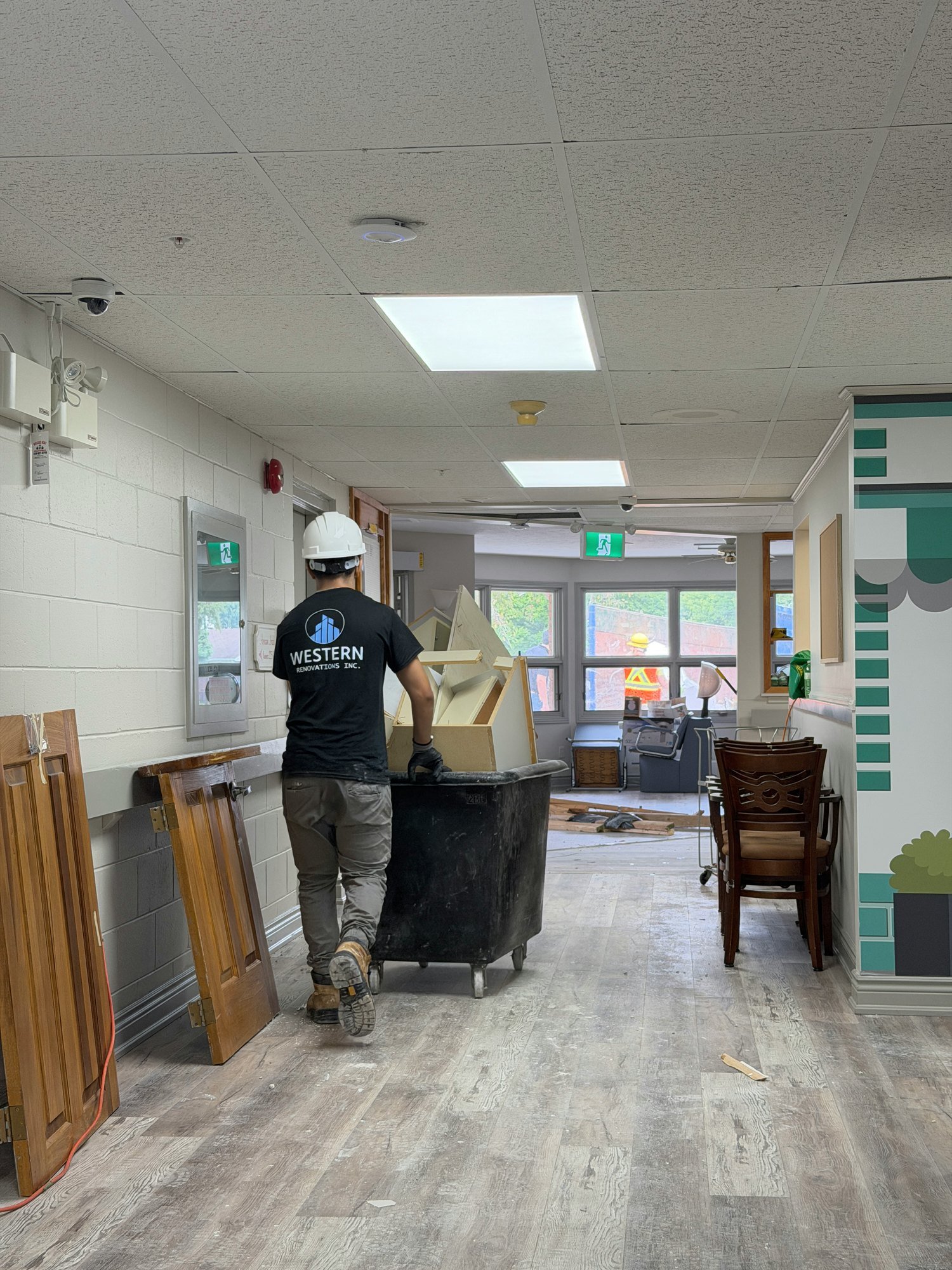 worker-hauling-materials-corridor-cart-chatham-ontario-01.jpg