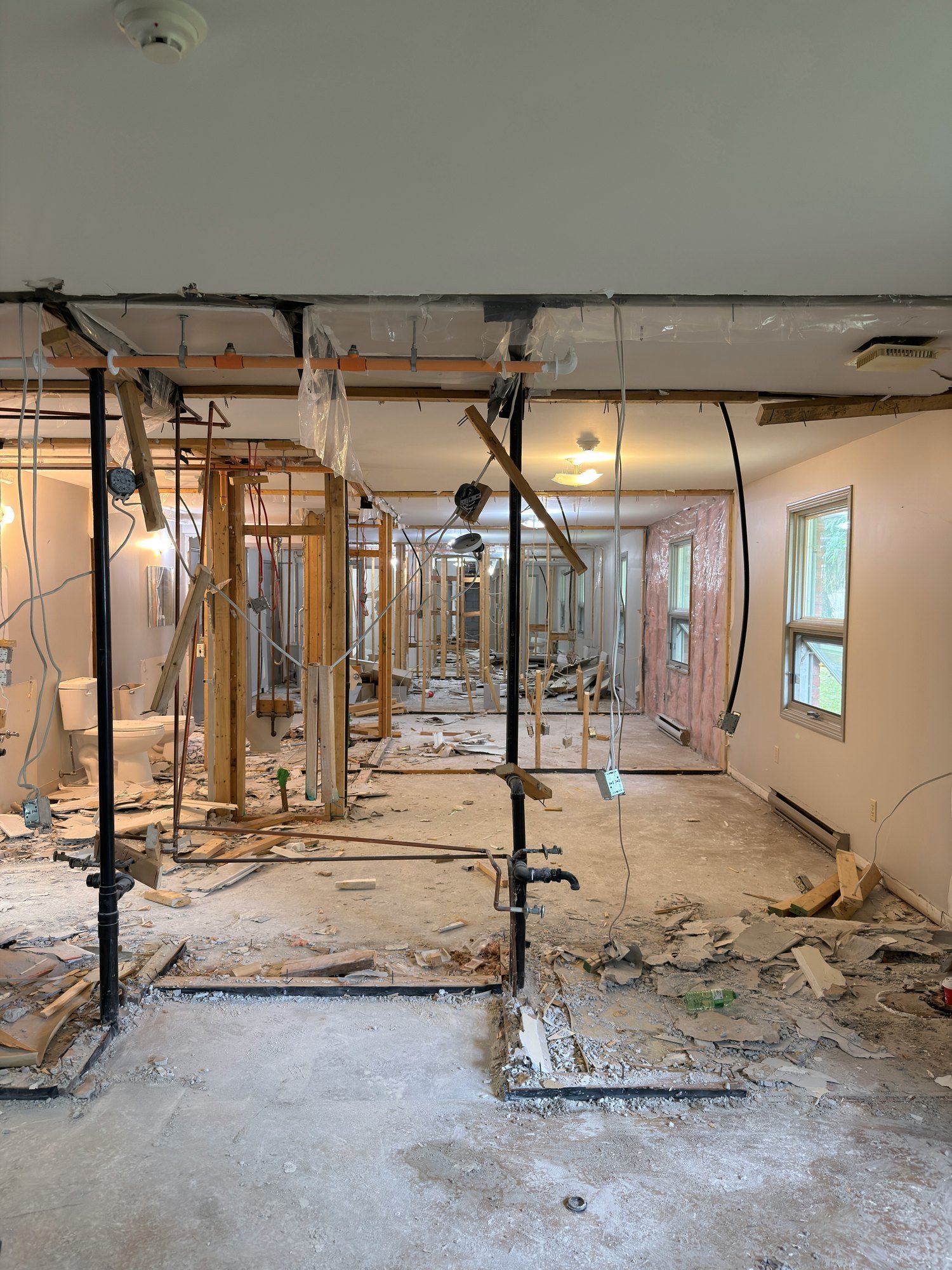 bare-studs-plumbing-lines-rubble-floor-chatham-ontario-01.jpg
