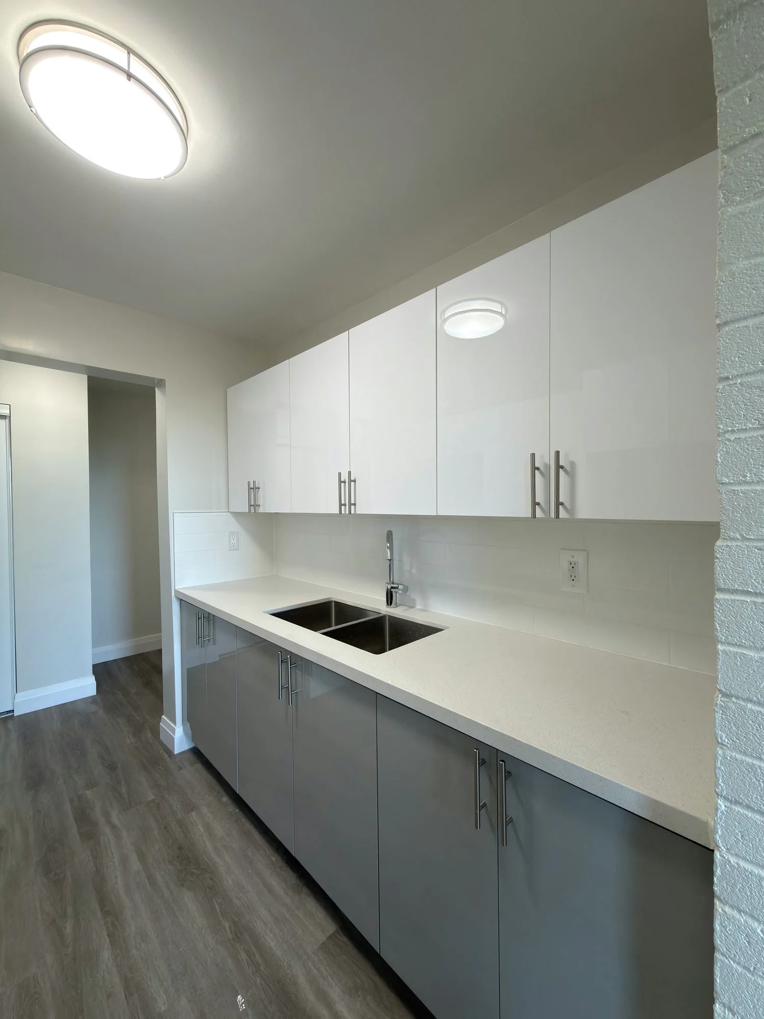 long-finished-kitchen-white-uppers-grey-base-london-ontario-01.jpg