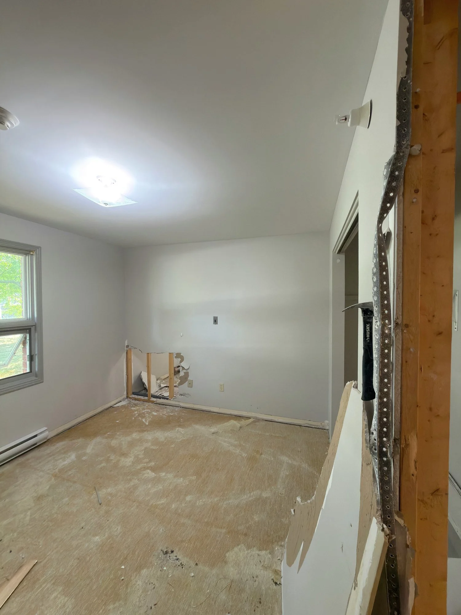 empty-room-stripped-floor-wall-framing-chatham-ontario-01.jpg