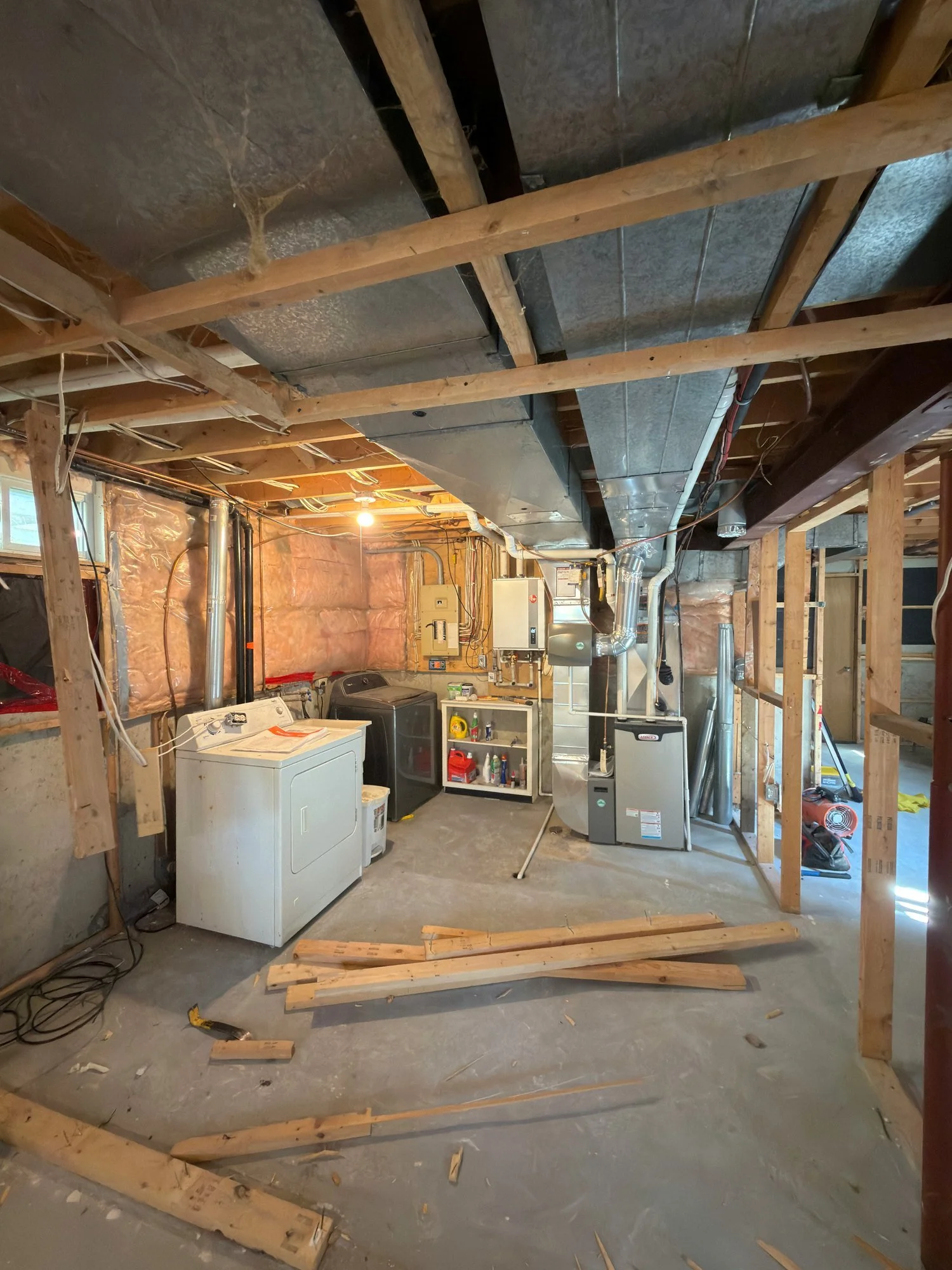 basement-demolition-exposed-framing-laundry-area-london-ontario-01.jpg