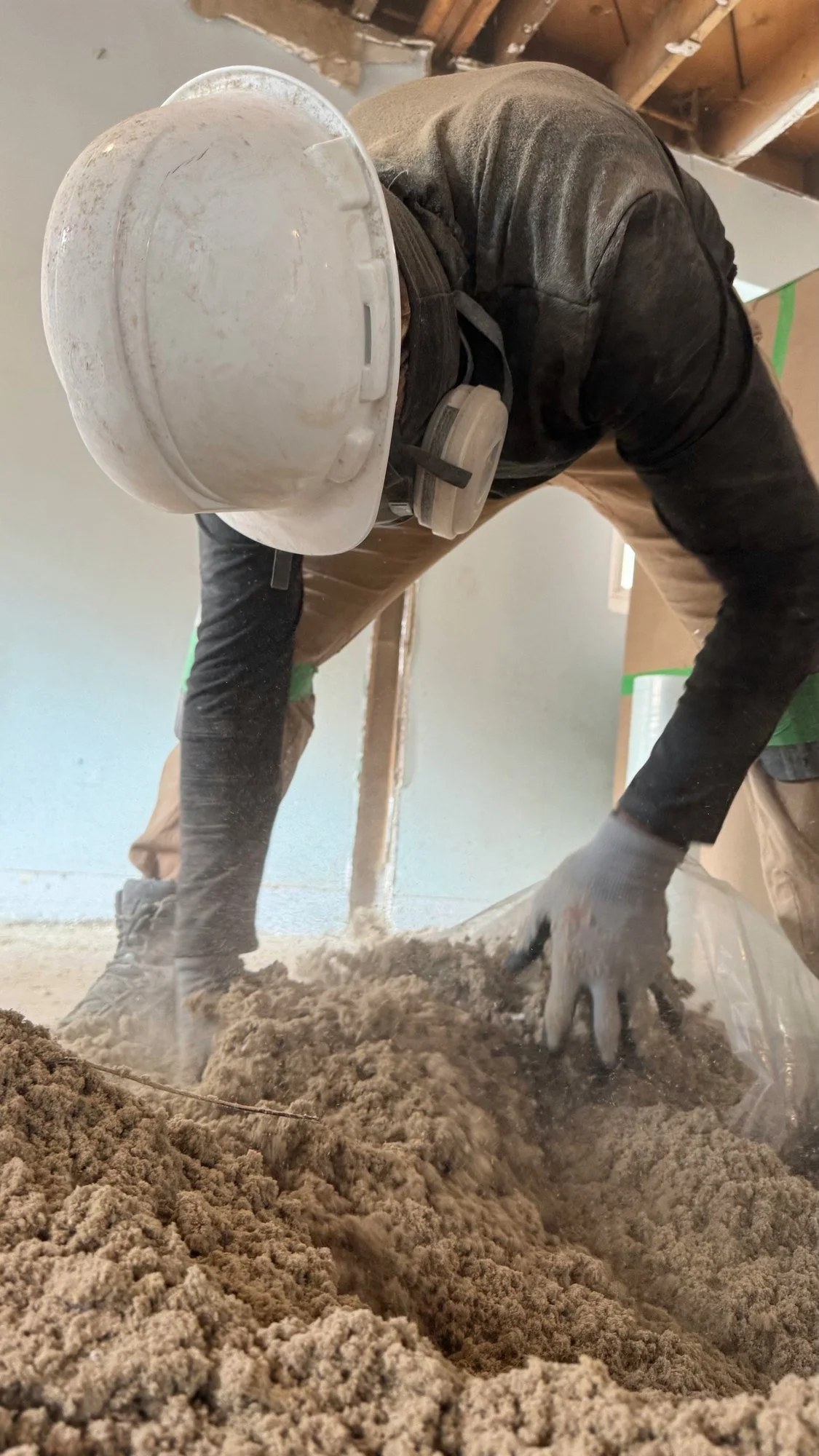 worker-hard-hat-clearing-insulation-debris-london-ontario-01.jpg
