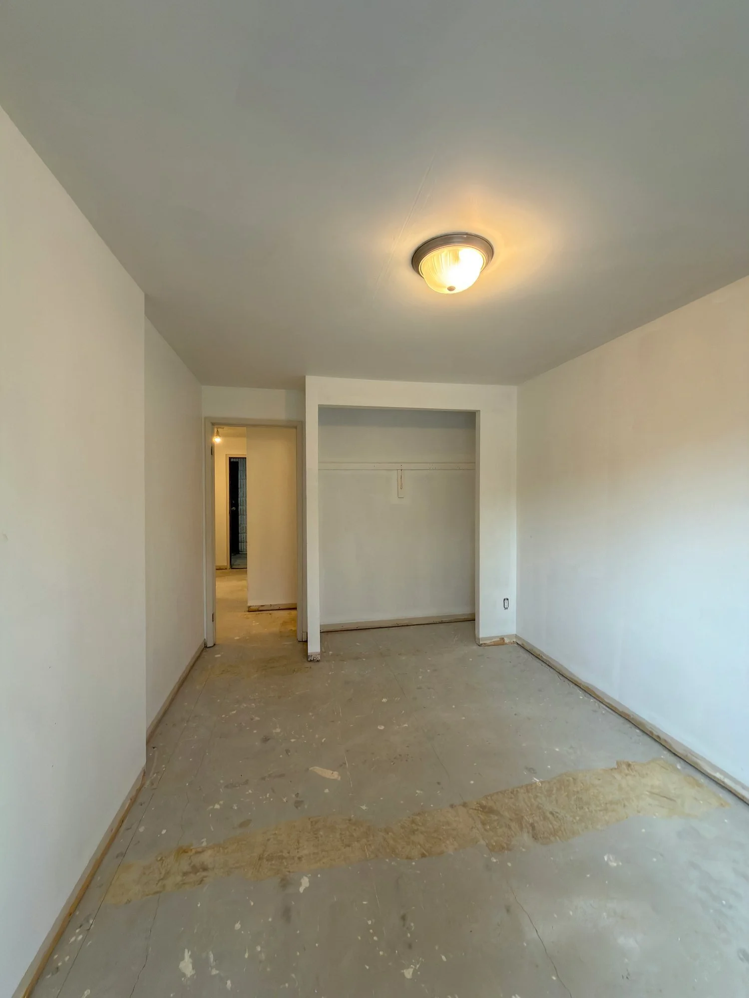 old-flooring-removed-bare-subfloor-hallway-tillsonburg-ontario-01.jpg