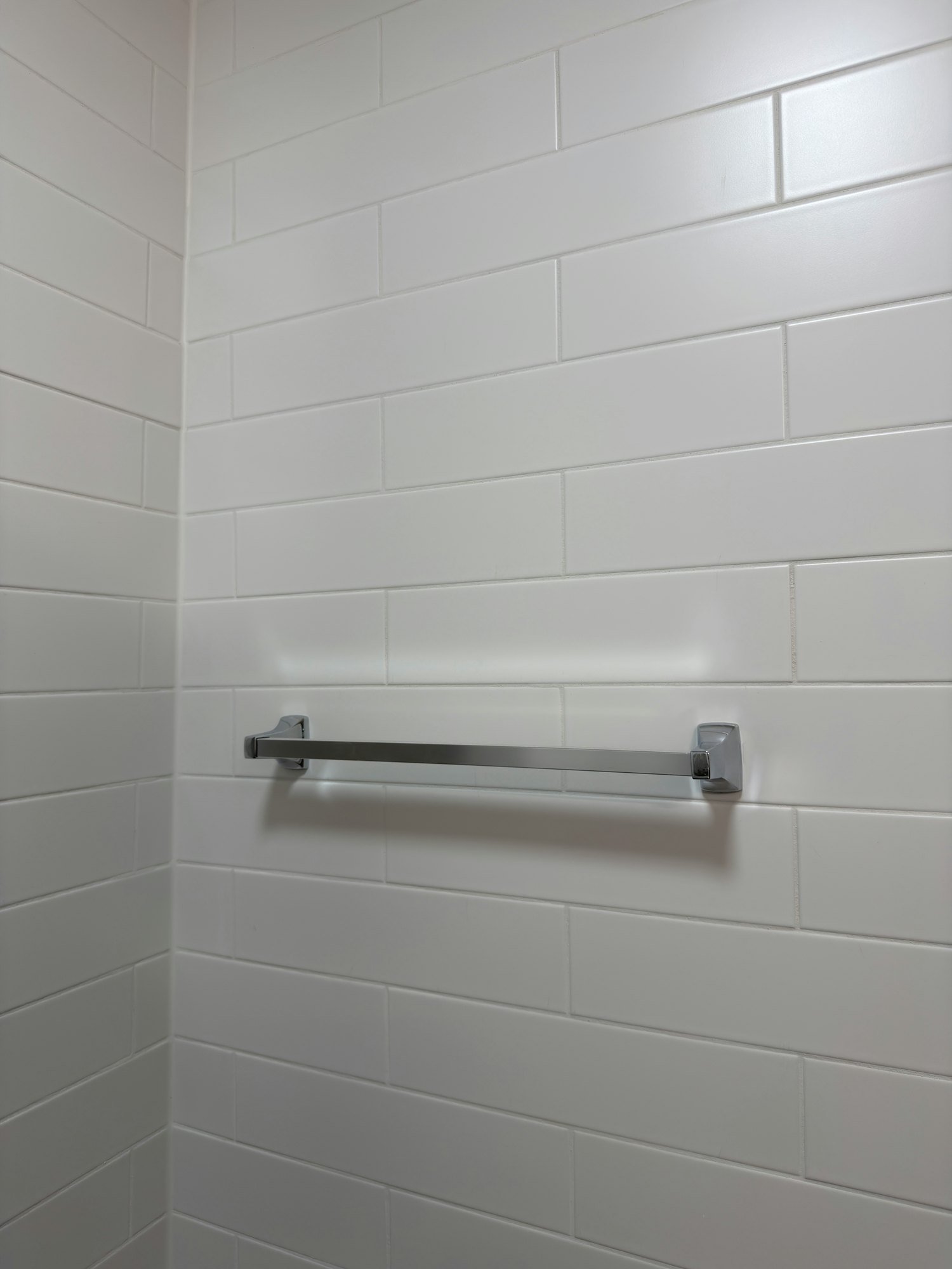 bathroom-tile-wall-towel-bar-finished-windsor-ontario-01.jpg