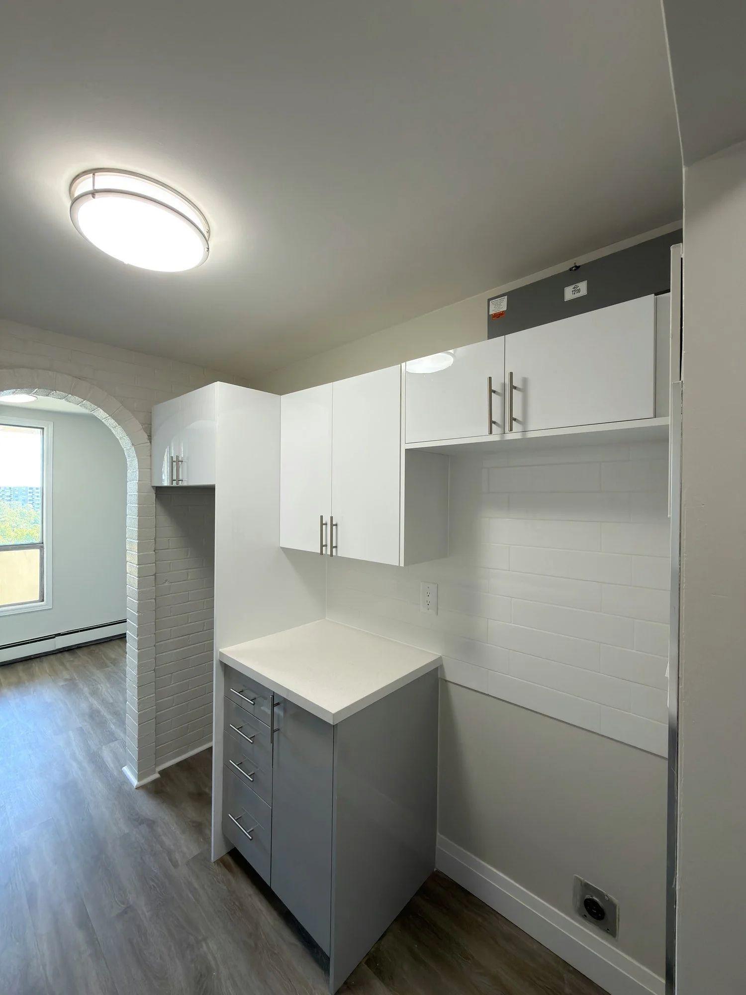 finished-kitchenette-white-cabinets-grey-base-london-ontario-01.jpg