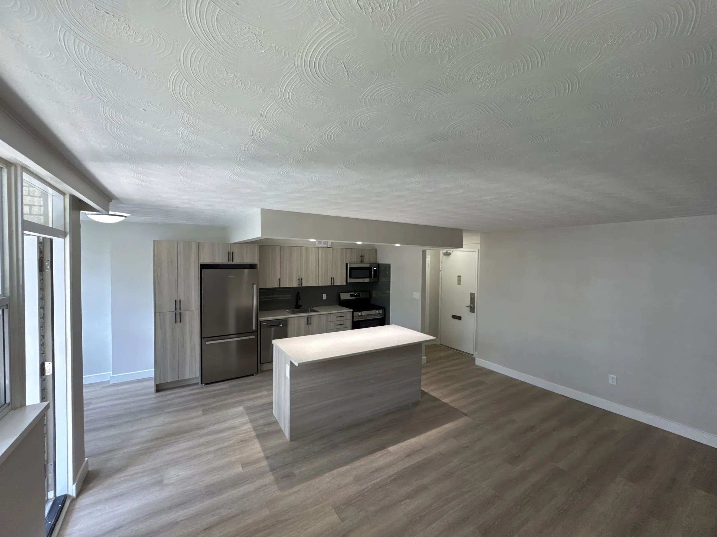 Experience the perfect blend of architectural cohesion and modern luxury. From the custom waterfall island to the vaulted ceilings, every detail reflects Western Renovations' commitment to technical precision and premium comfort.