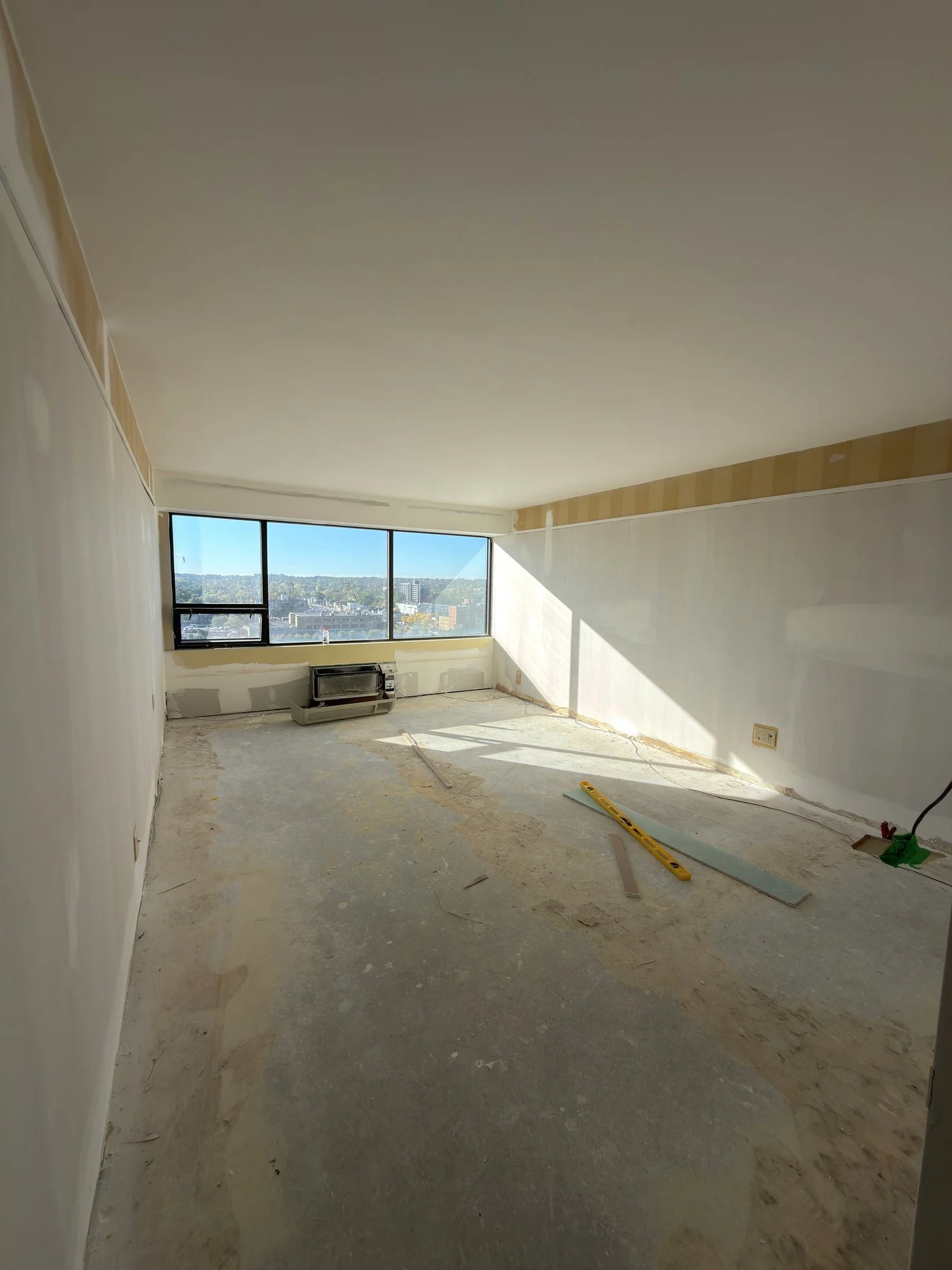 apartment-room-drywall-patched-subfloor-exposed-london-ontario-01.jpg