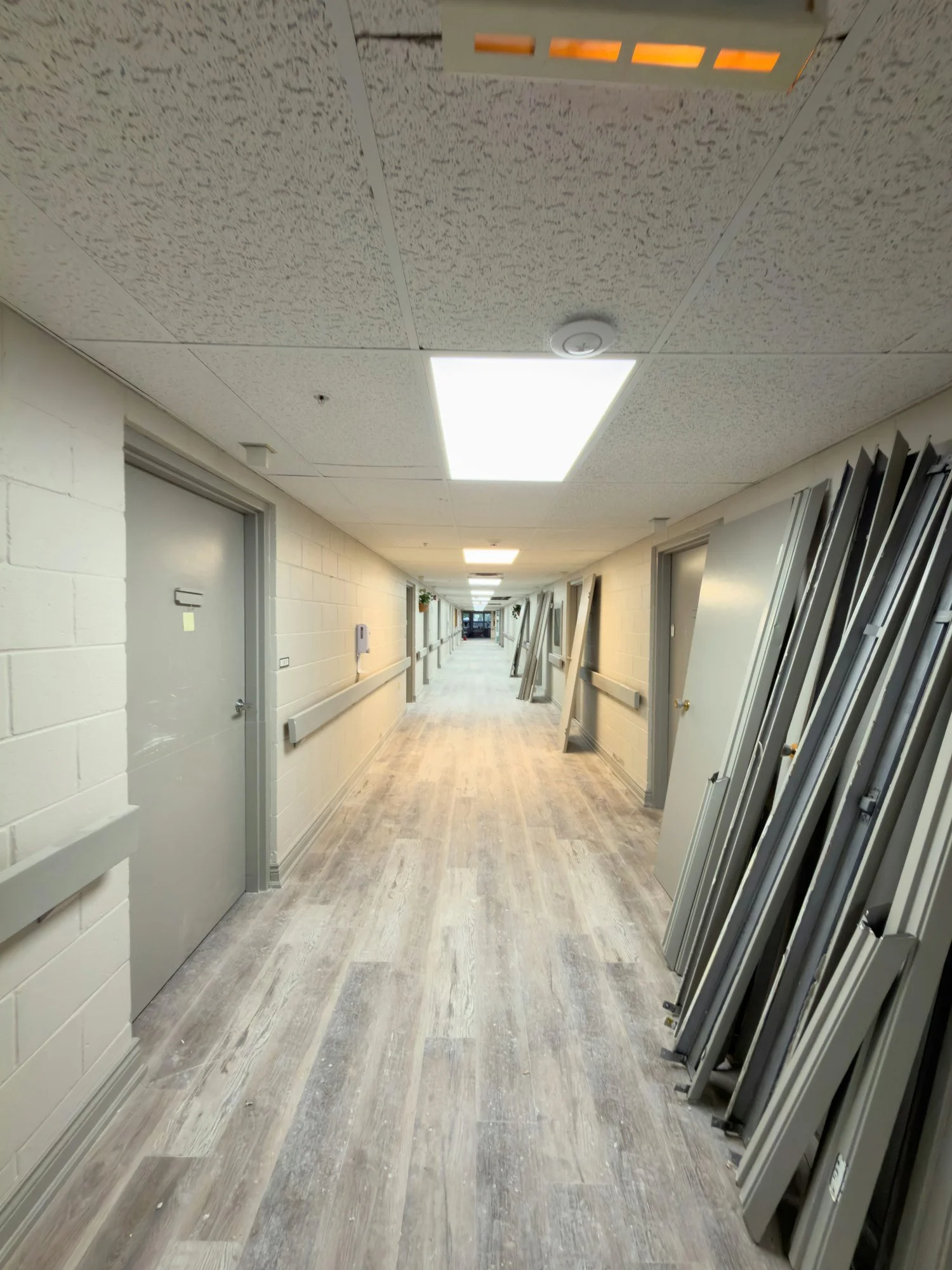 corridor-plank-floor-stacked-door-frames-chatham-ontario-01.jpg