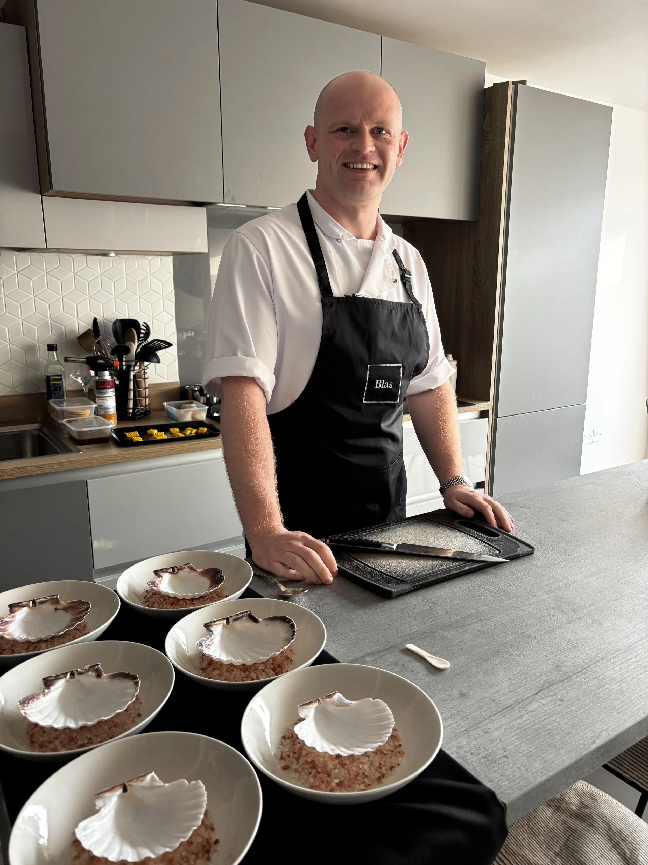 Chef Darren Morton at the kitchen counter preparing dishes for a private dining event in Scotland