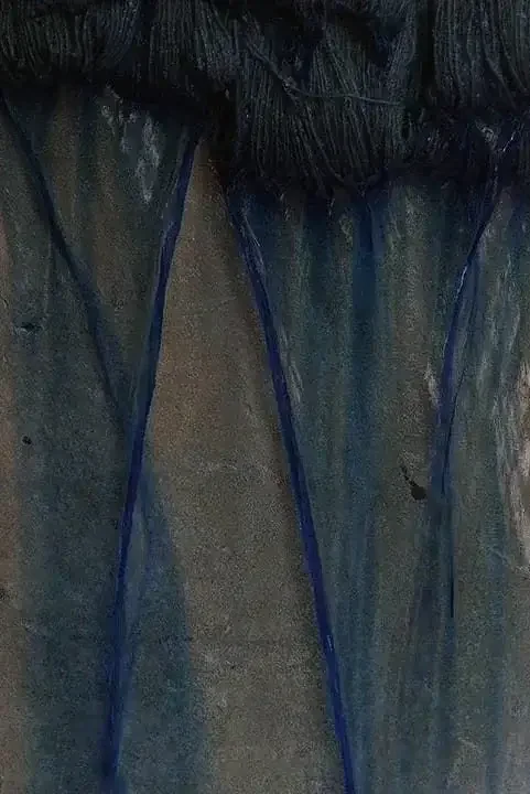 Traditional fabrics and weaving tools used in Egyptian handwoven carpet making