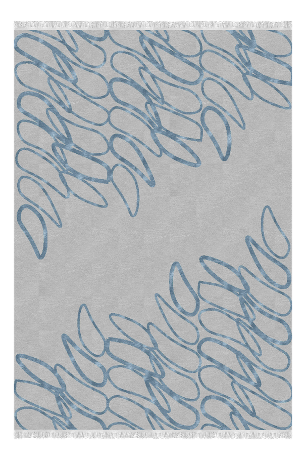 Close-up of a piece of fabric with a pattern of blue cursive letters, possibly spelling 'Dior,' on a light background.