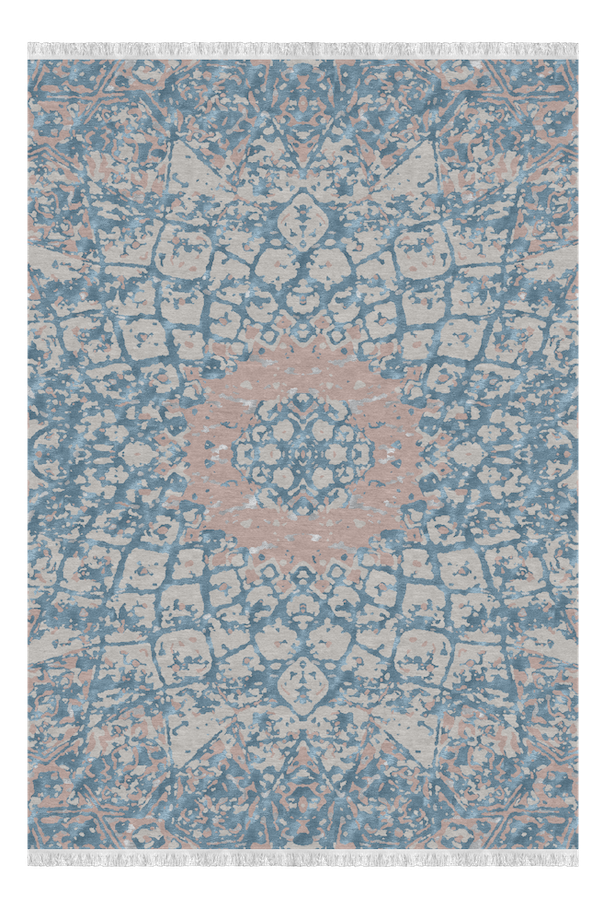 A decorative area rug with a distressed floral pattern in shades of blue, beige, and light pink.