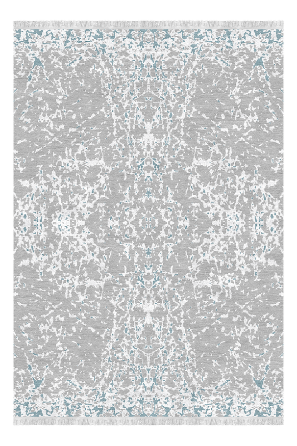 A patterned area rug with a light gray background, intricate white and faint blue designs, and fringed edges.