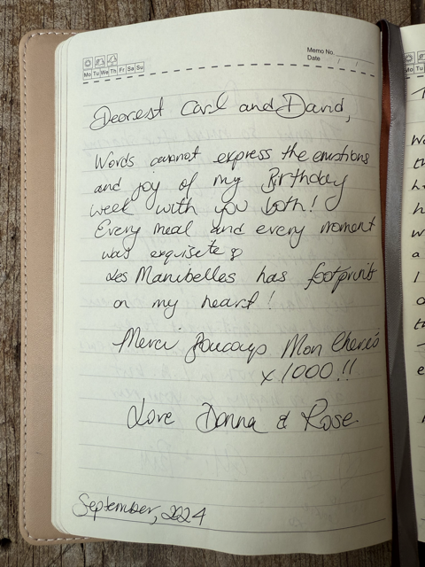 Handwritten note in a notebook with a wedding or birthday message, dated September 22, 24, on lined paper.