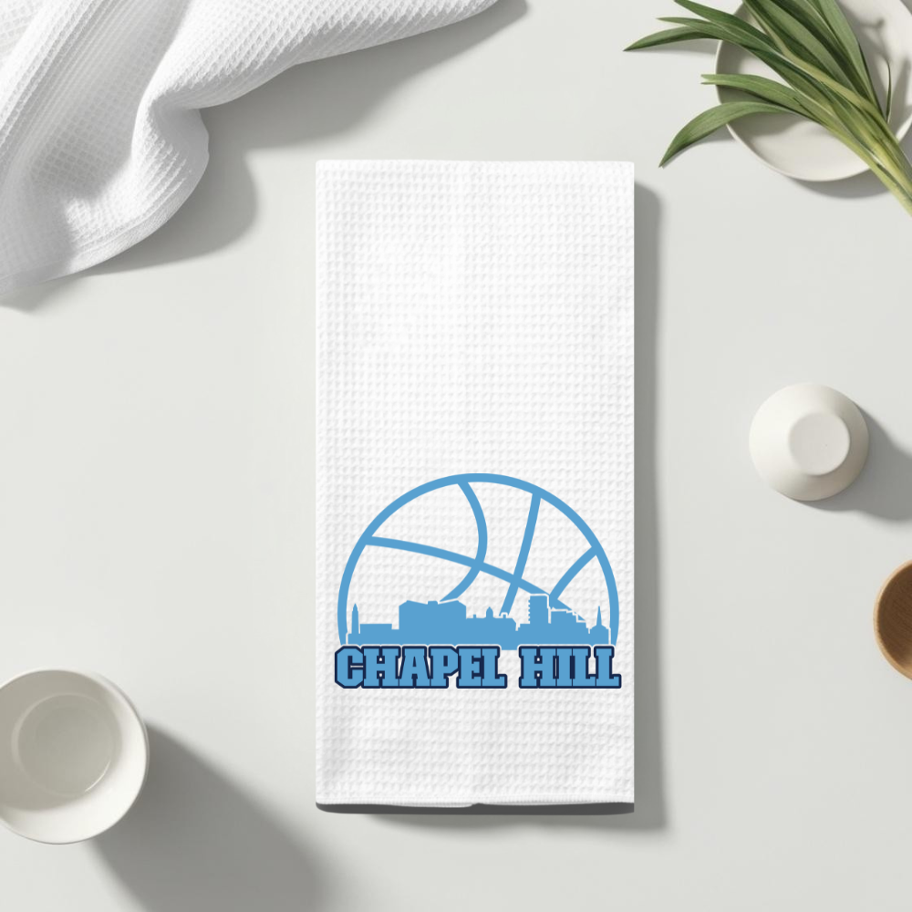 UNC Chapel Hill waffle weave dish towel laid flat with bright overhead lighting.