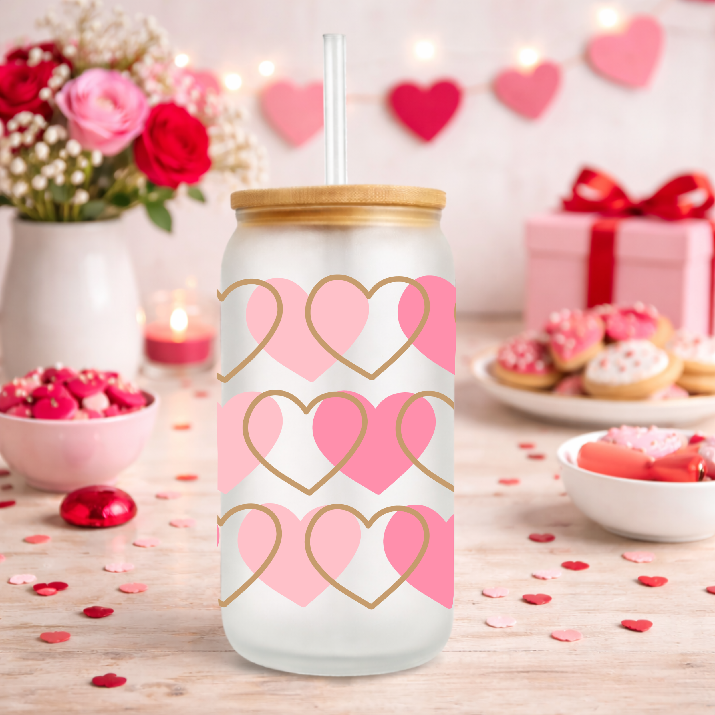 Photo 3 of a frosted Libbey glass can with pink and gold hearts in a Valentine’s Day kitchen scene with flowers and cookies.