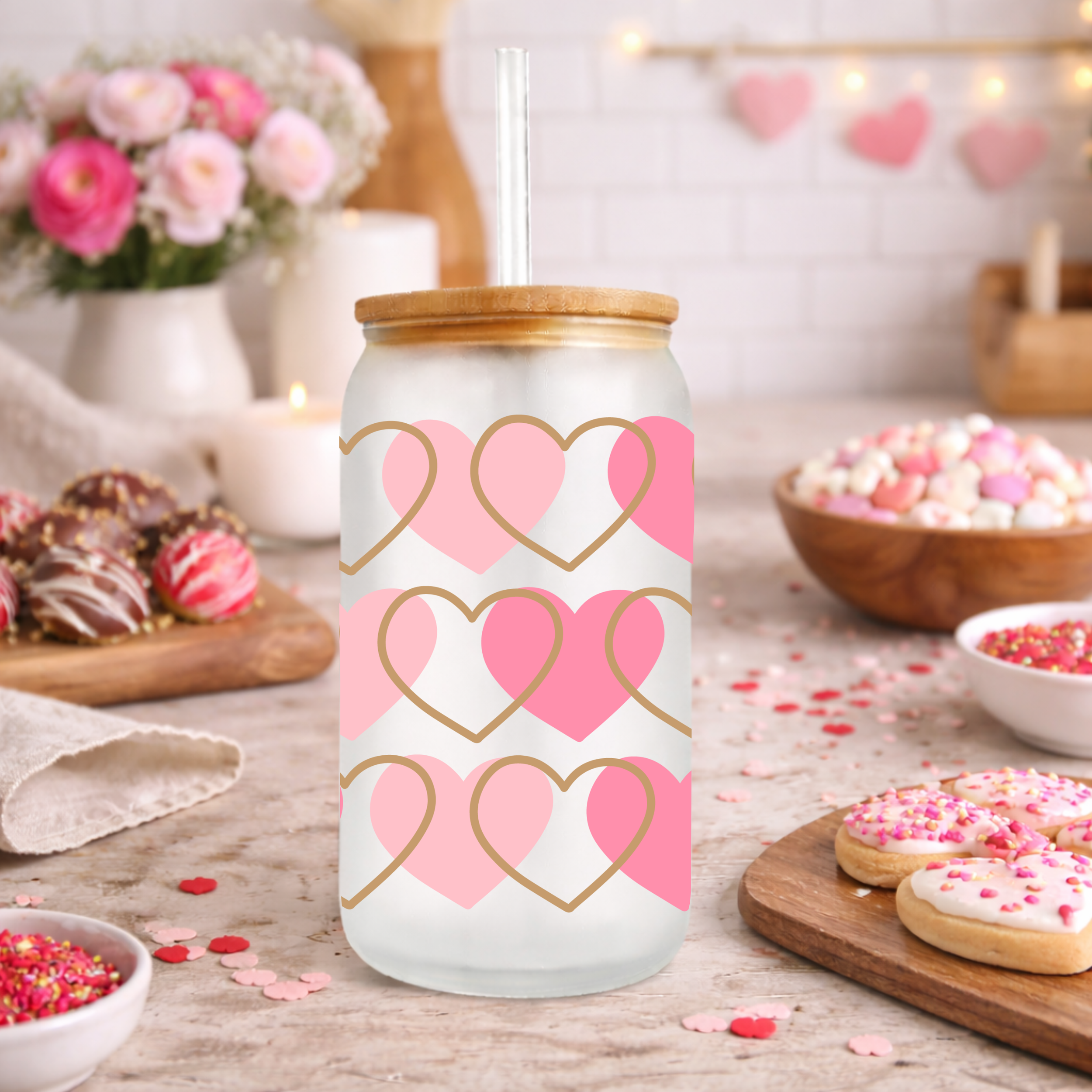 Photo 4 of a pink and gold heart glass can cup styled with Valentine desserts, sprinkles, and baking decor.