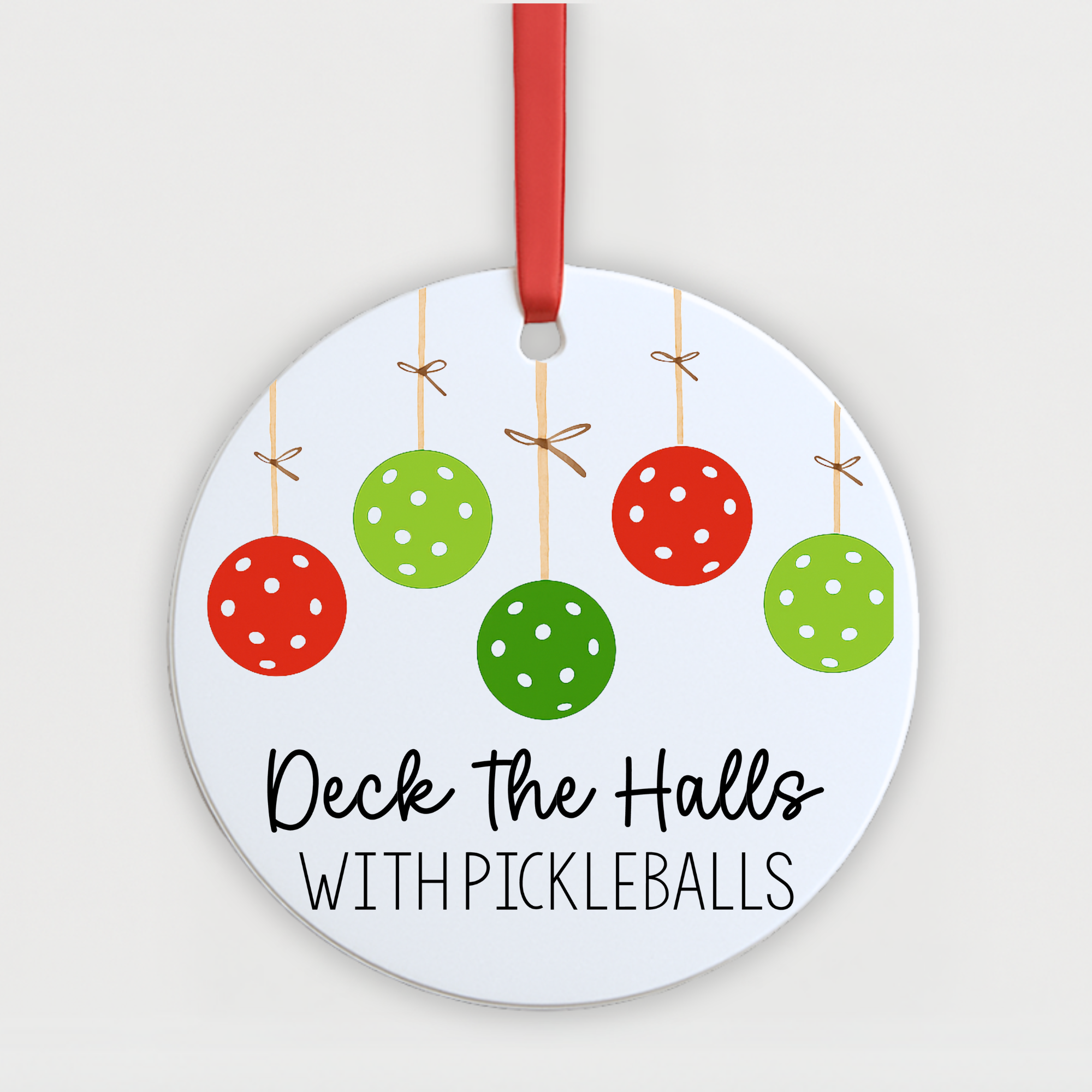 “Deck the Halls with Pickleballs ornament featuring red and green pickleball baubles on a round holiday decoration.”