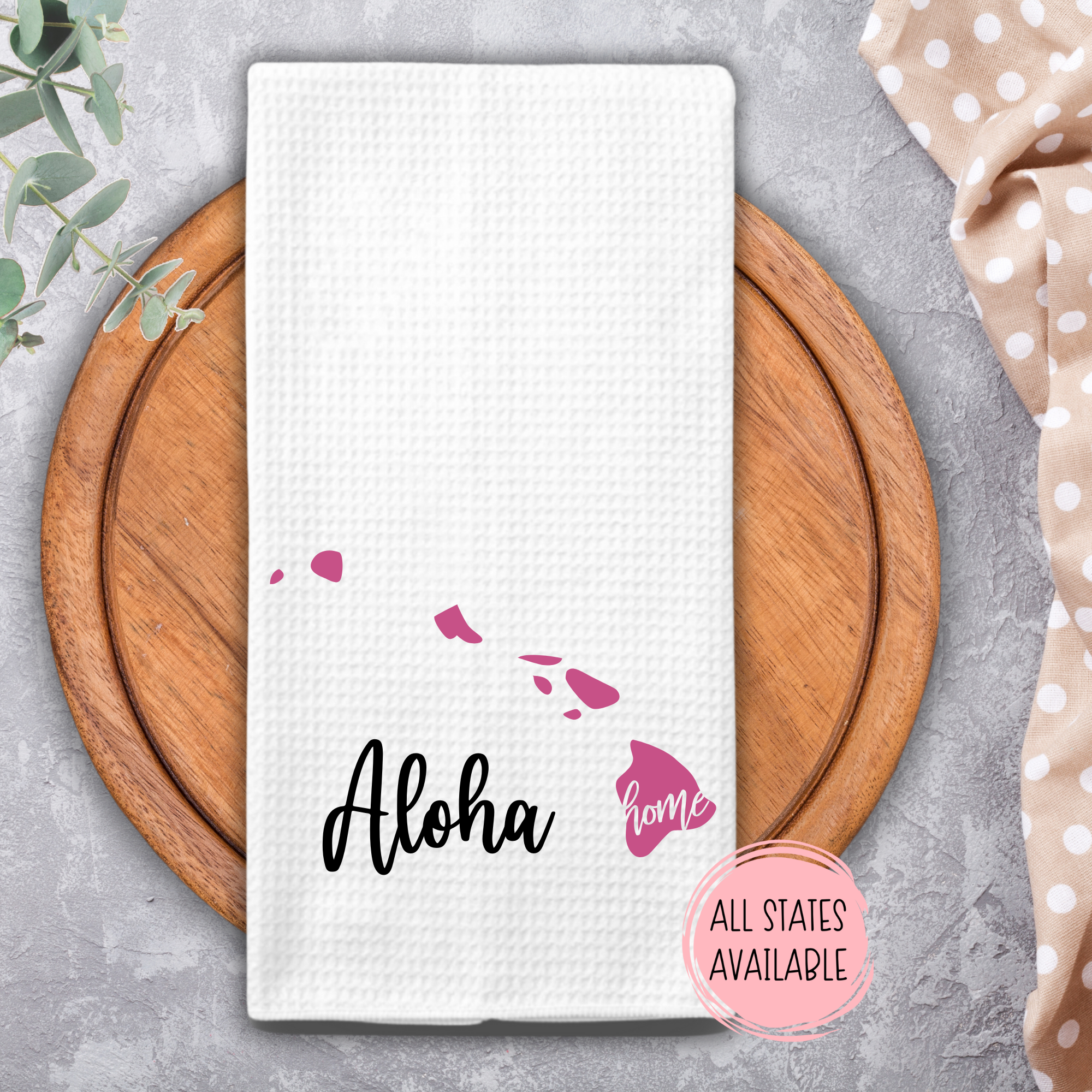 Custom Hawaii home towel with pink islands and Aloha design on wooden tray.
