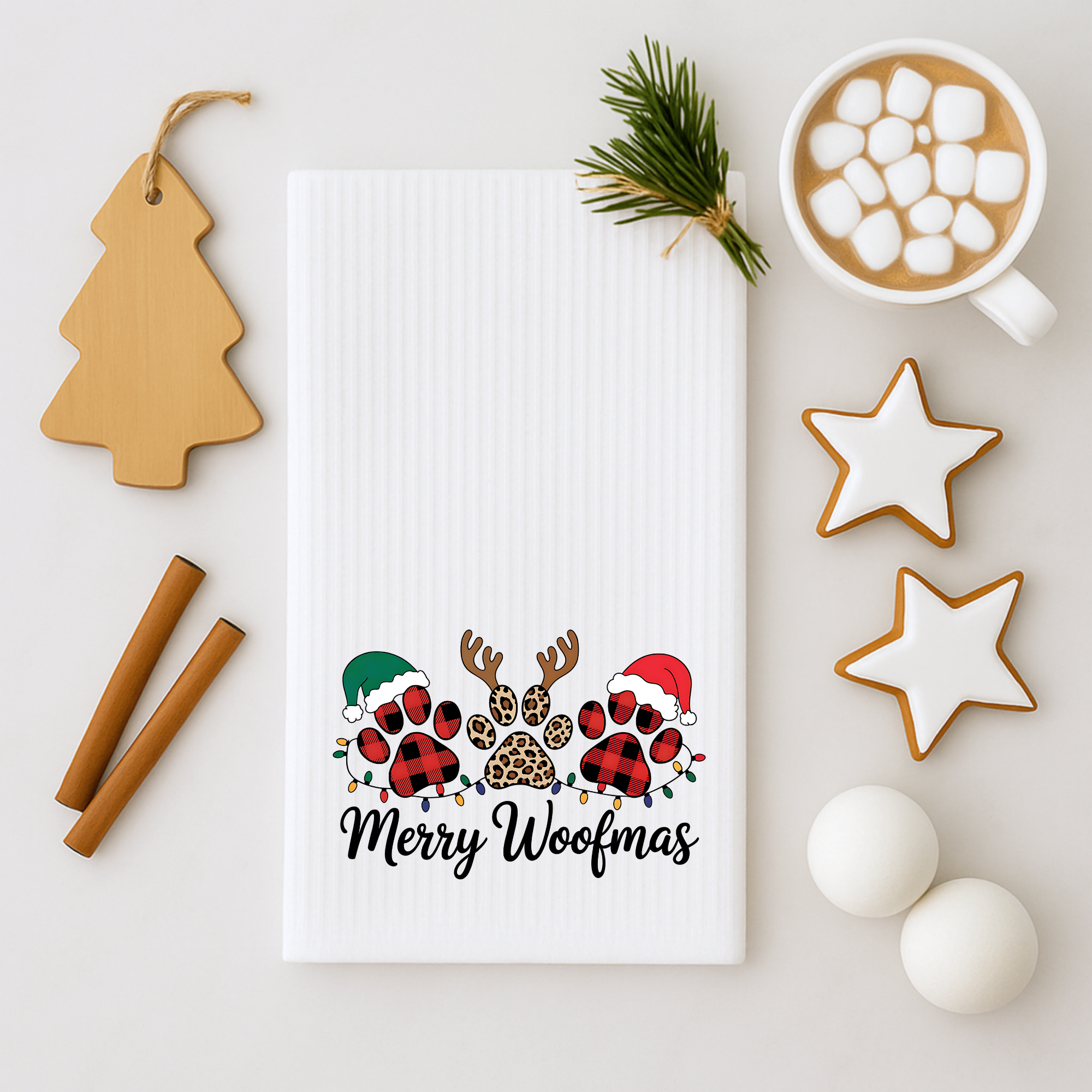 Merry Woofmas dog Christmas kitchen towel styled with hot cocoa and holiday cookies.