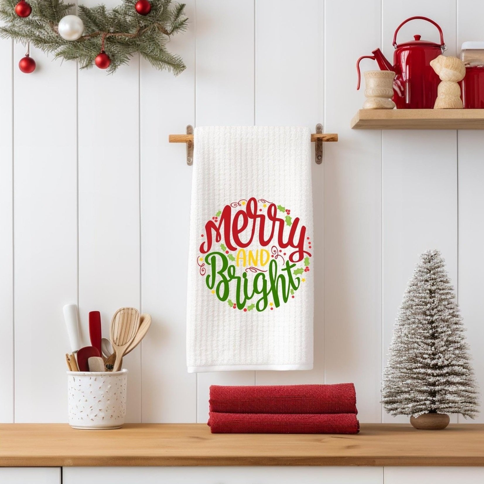 Christmas kitchen towel hanging in a festive kitchen with red and white accents, adding a cozy holiday touch to seasonal decor.