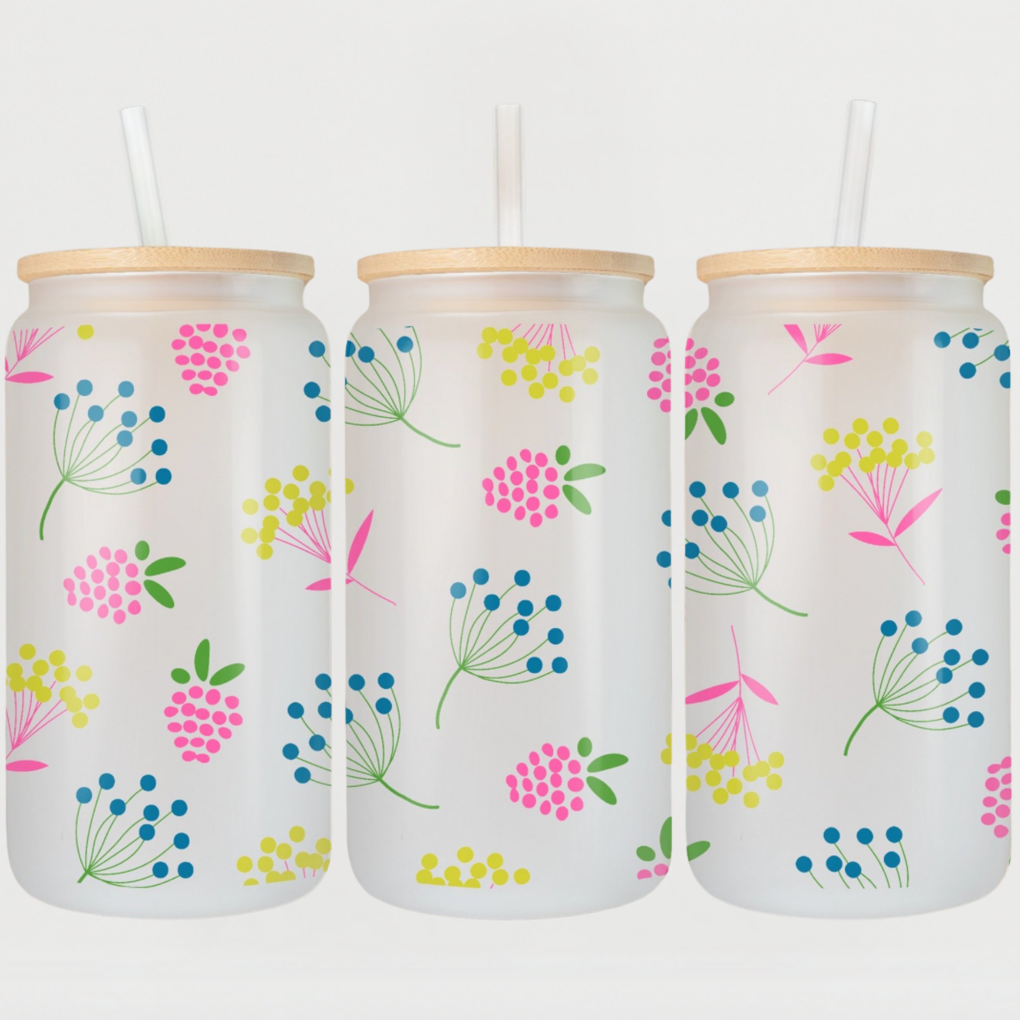 Colorful frosted glass tumbler with pink berries, blue and yellow wildflowers, and green leaves.