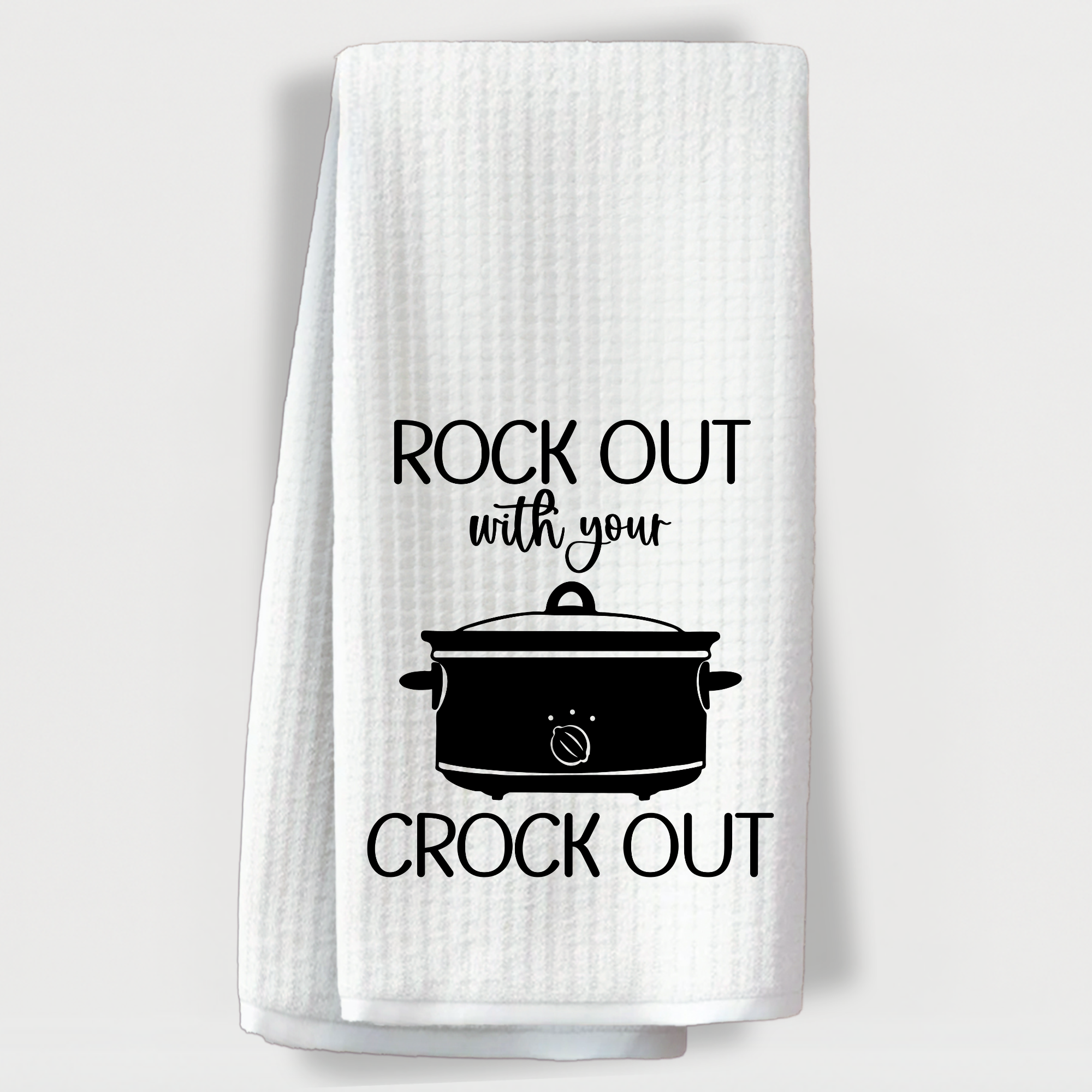 Funny crockpot-themed towel with the quote, “Rock out with your crock out.”