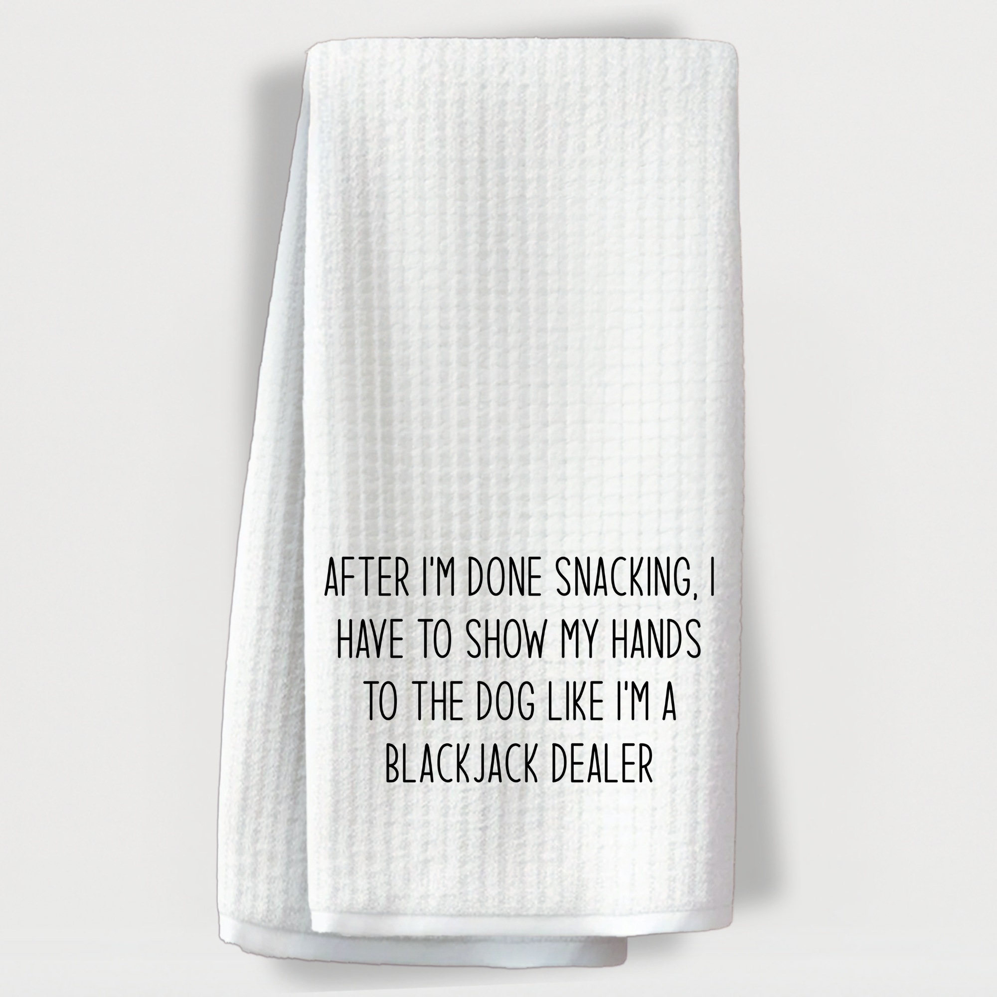 Humorous towel with the quote 'After I’m done snacking, I show my hands to the dog like a blackjack dealer.'