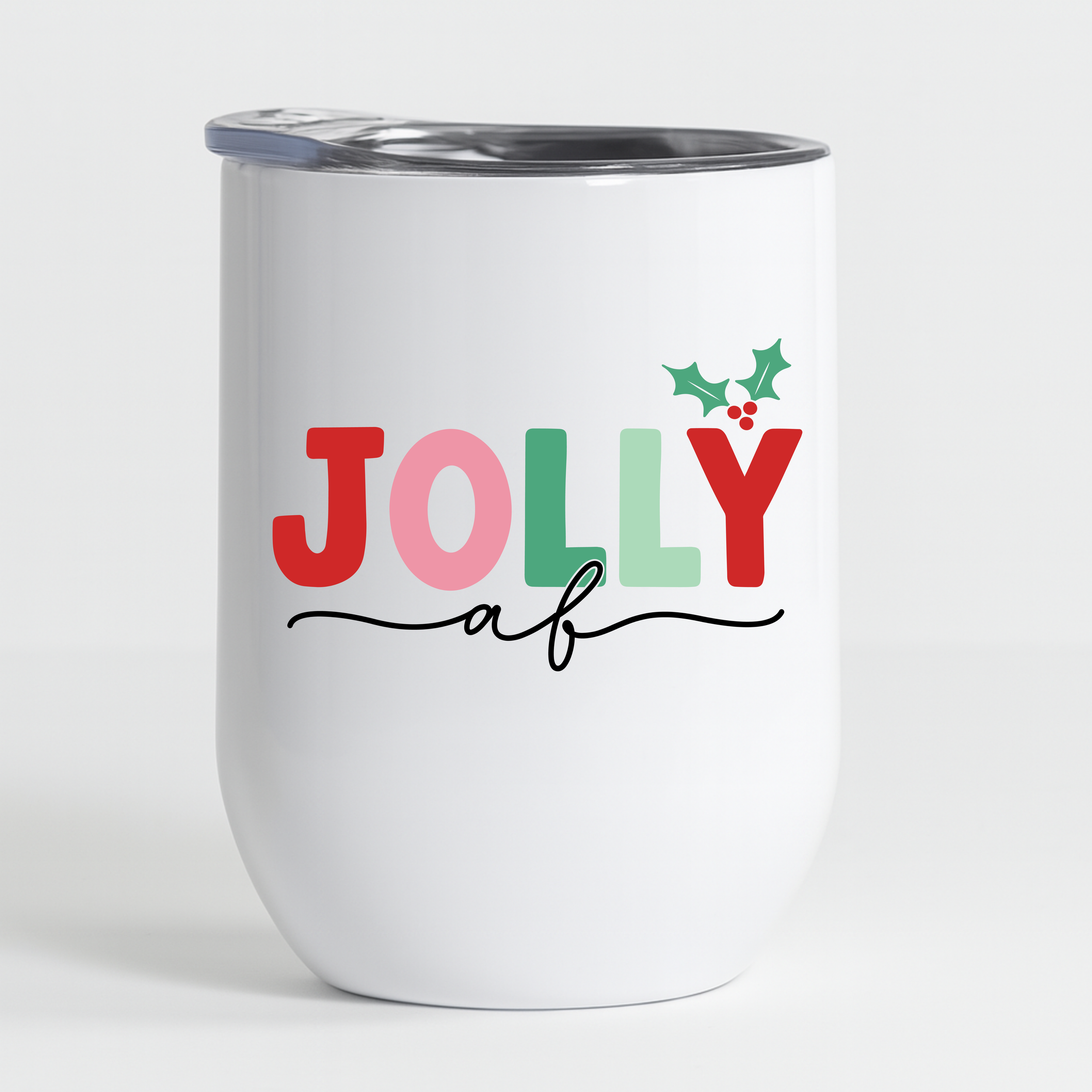 Jolly AF tumbler close-up on a clean white background with holly accent design.