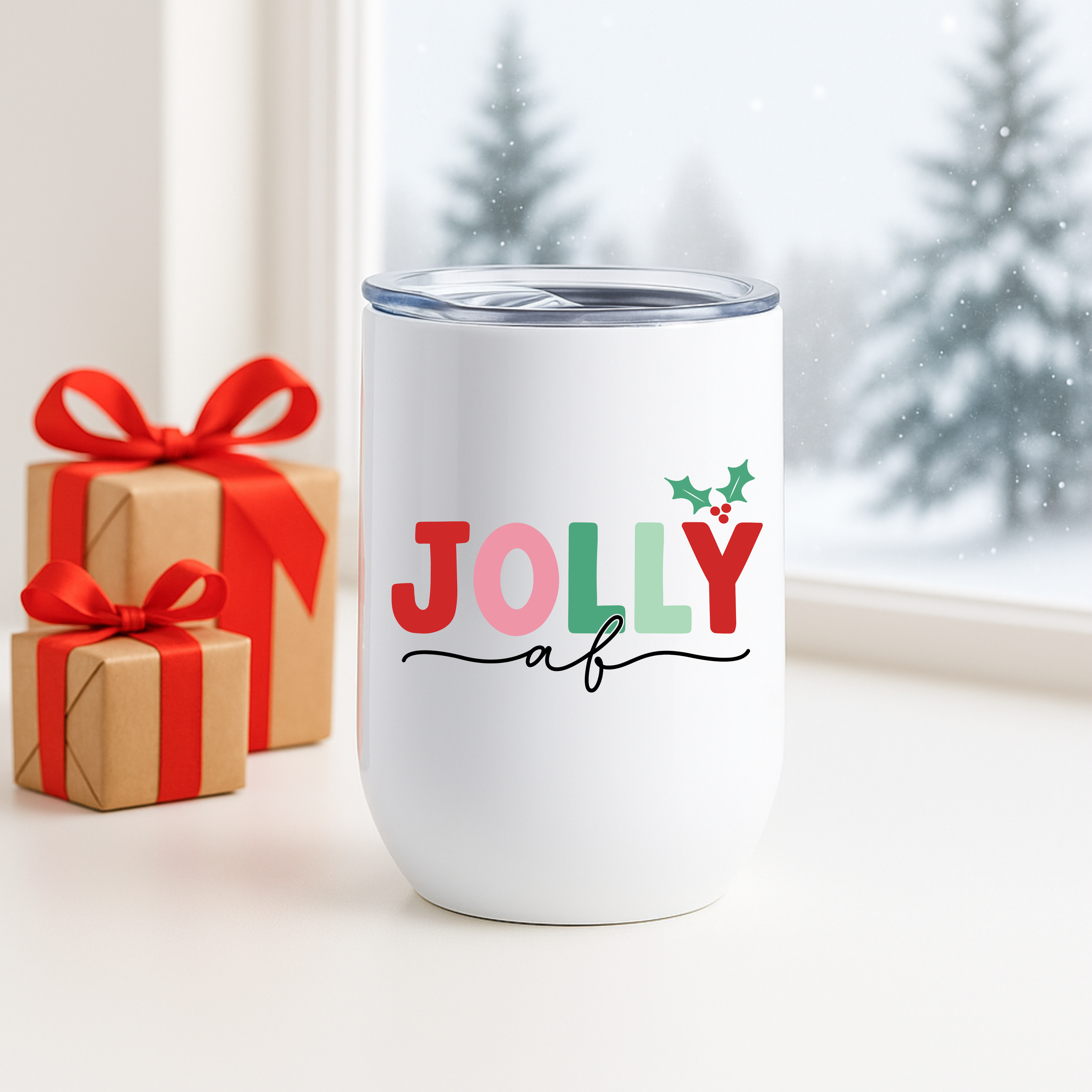 Jolly AF tumbler placed beside wrapped presents in front of a snowy winter window.