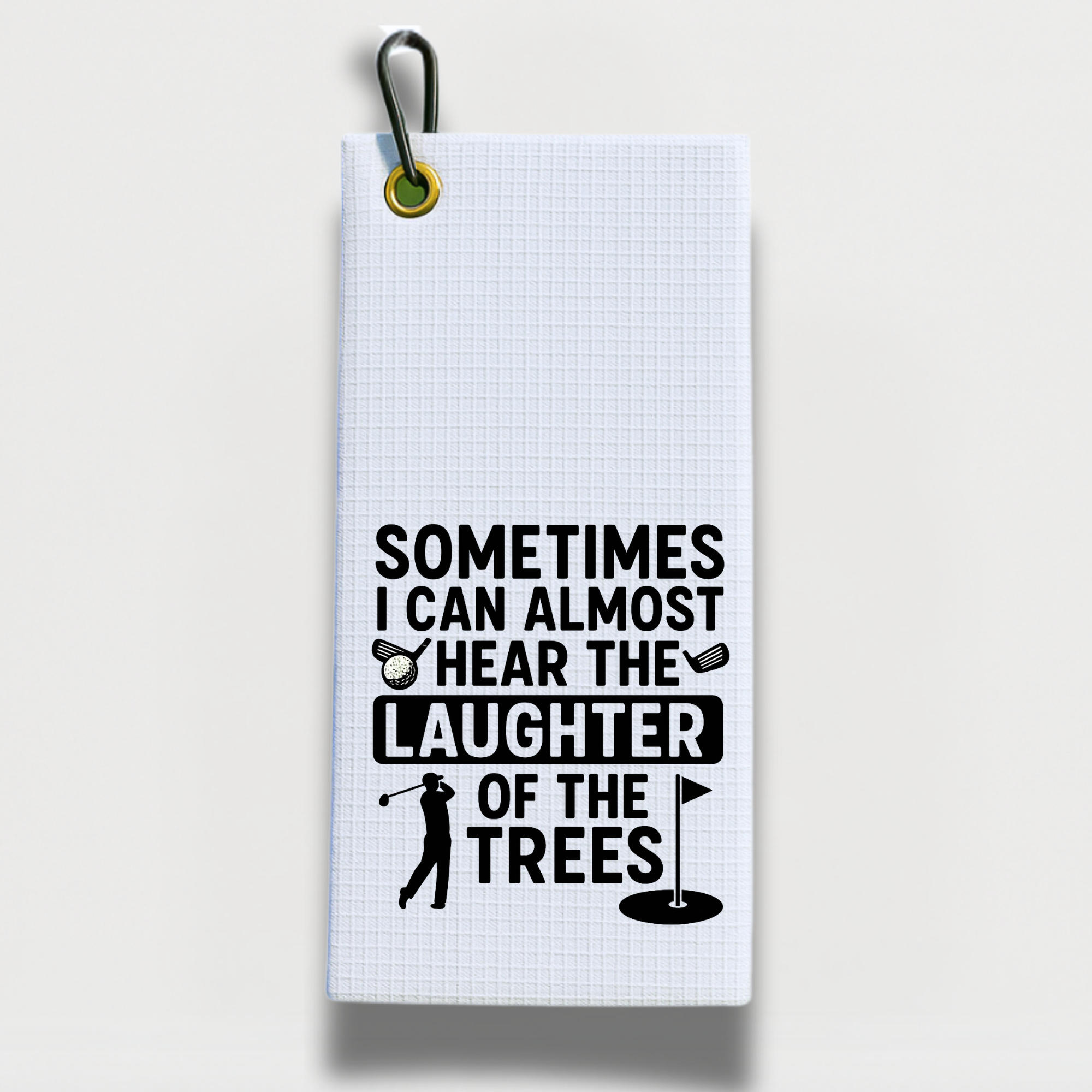 Golf towel with the quote 'Sometimes I can almost hear the laughter of the trees' and golf icons.