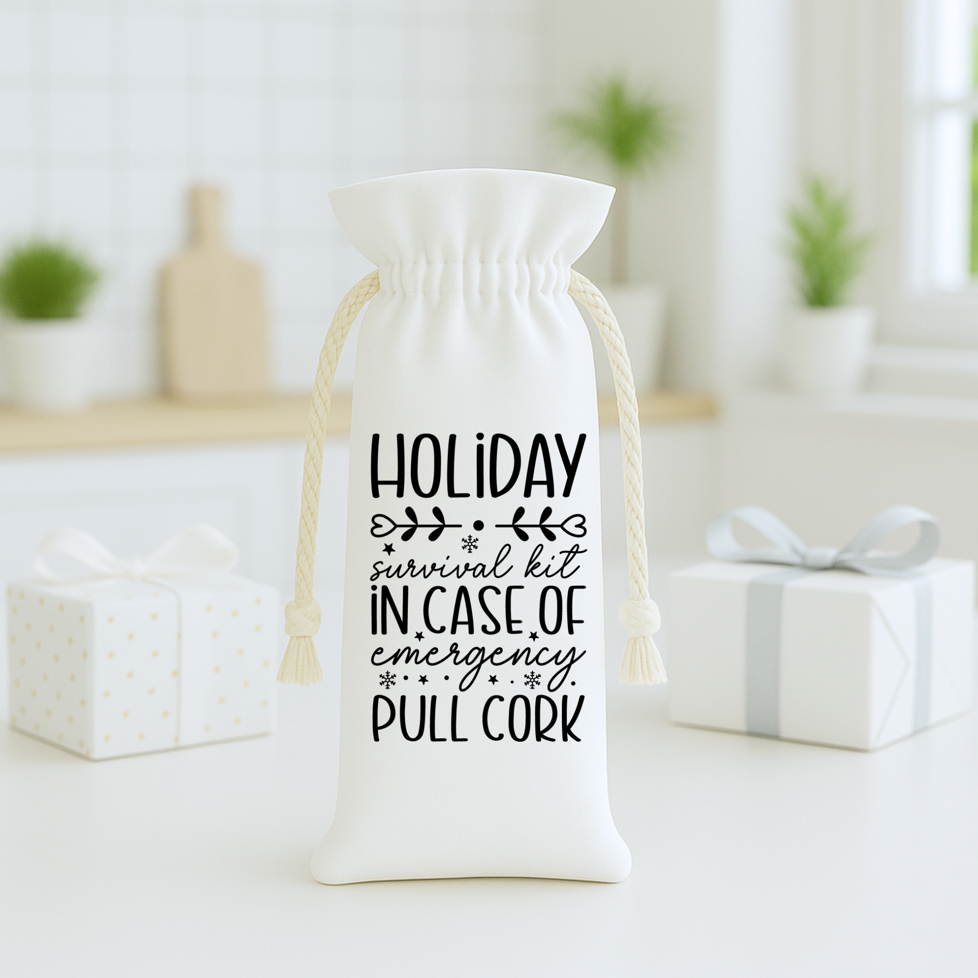 White holiday wine bag with “Holiday Survival Kit – In Case of Emergency Pull Cork” displayed in a bright kitchen setting.
