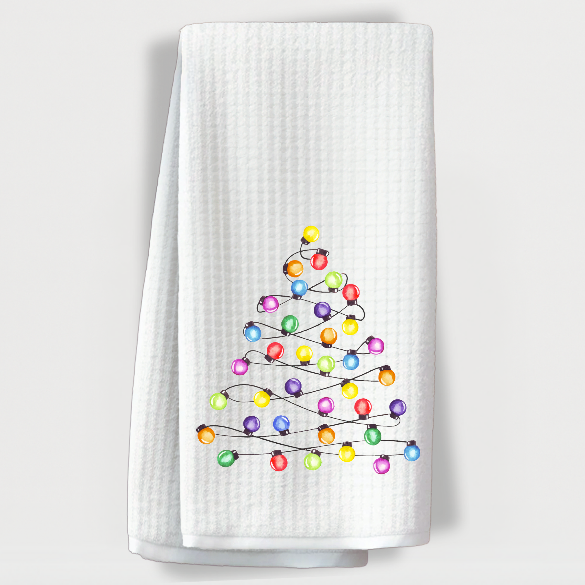 Christmas kitchen towel featuring tree made of festive bulbs.