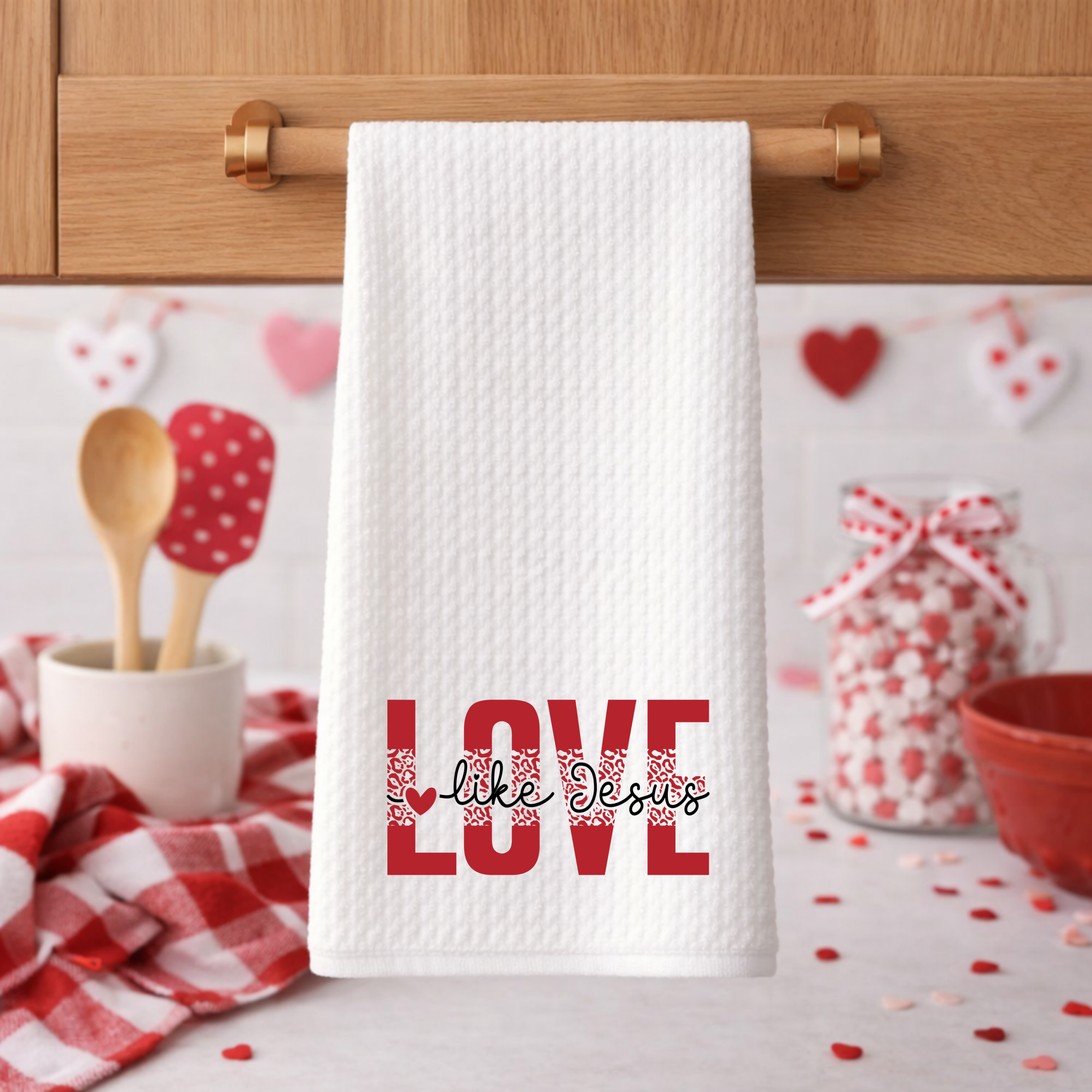 White waffle weave “Love Like Jesus” towel styled in cozy Valentine kitchen setting.