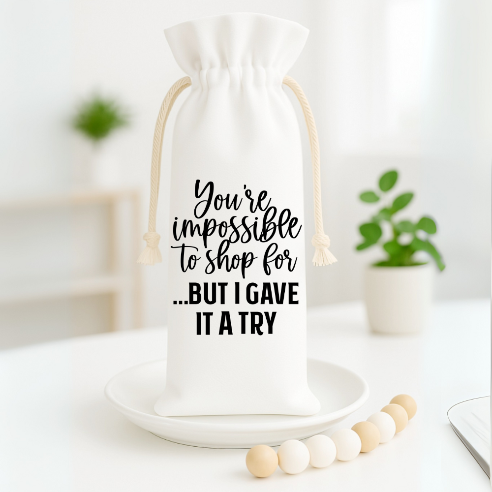 Reusable wine bag with humorous quote displayed in a bright, minimalist home setting.