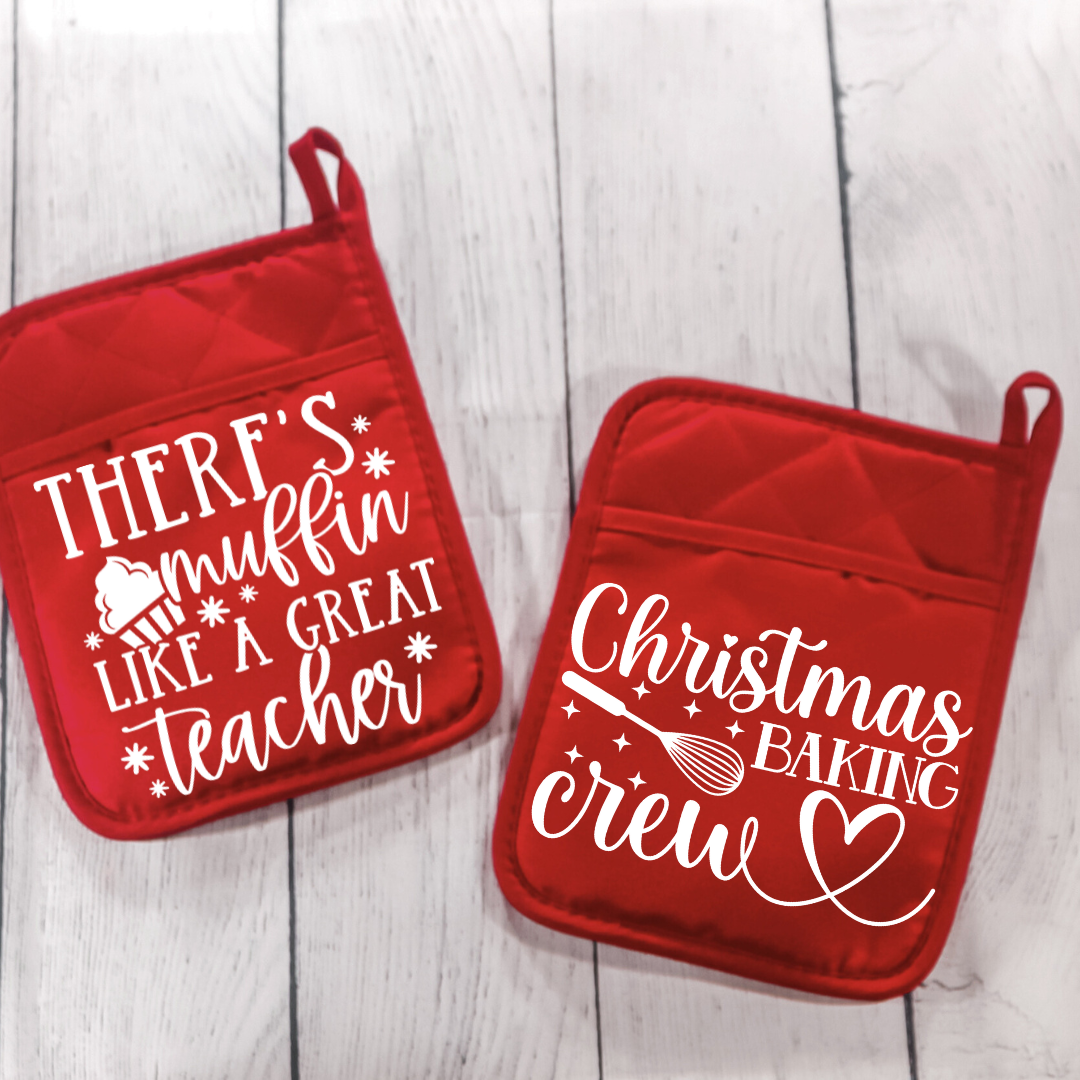 Funny holiday baking pot holders set – Two red pot holders with "There's Muffin Like a Great Teacher" and "Christmas Baking Crew" designs, perfect holiday gifts.