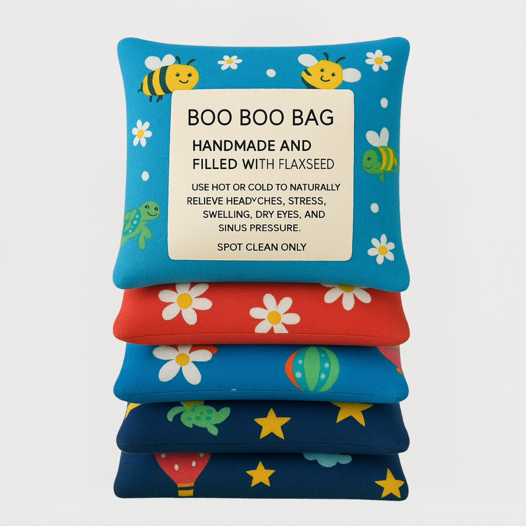 Stacked Boo Boo Bags featuring bees, flowers, turtles, and stars, ideal for kids’ natural pain relief.