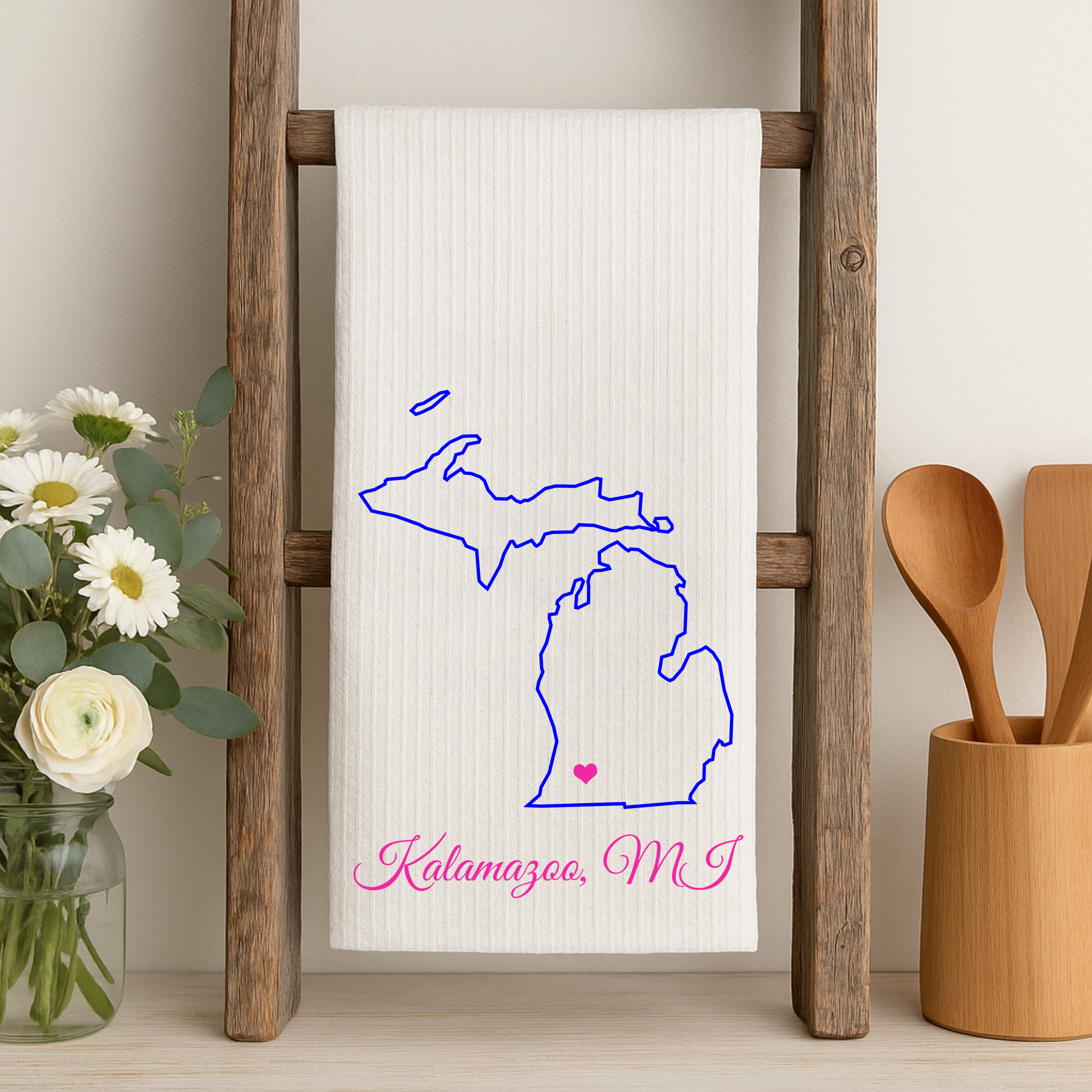 White towel with blue Michigan outline and pink heart for Kalamazoo, MI.