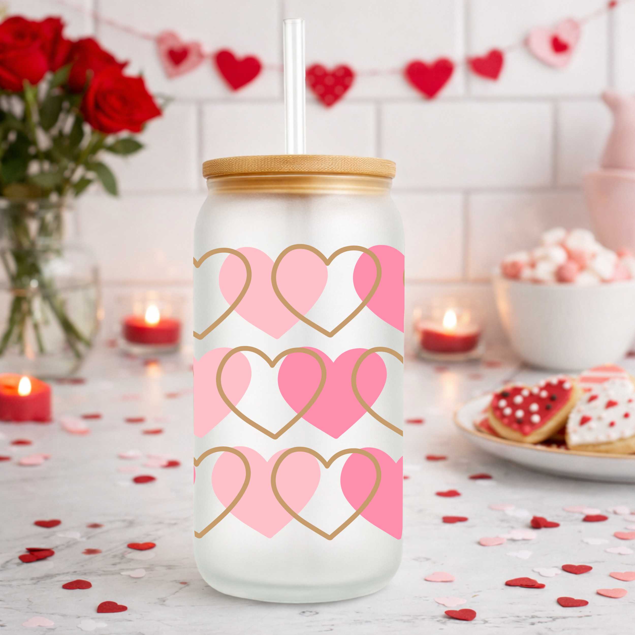 Photo 2 of a Valentine’s Day glass can cup with pink and gold hearts styled on a kitchen counter with candles and heart decor.