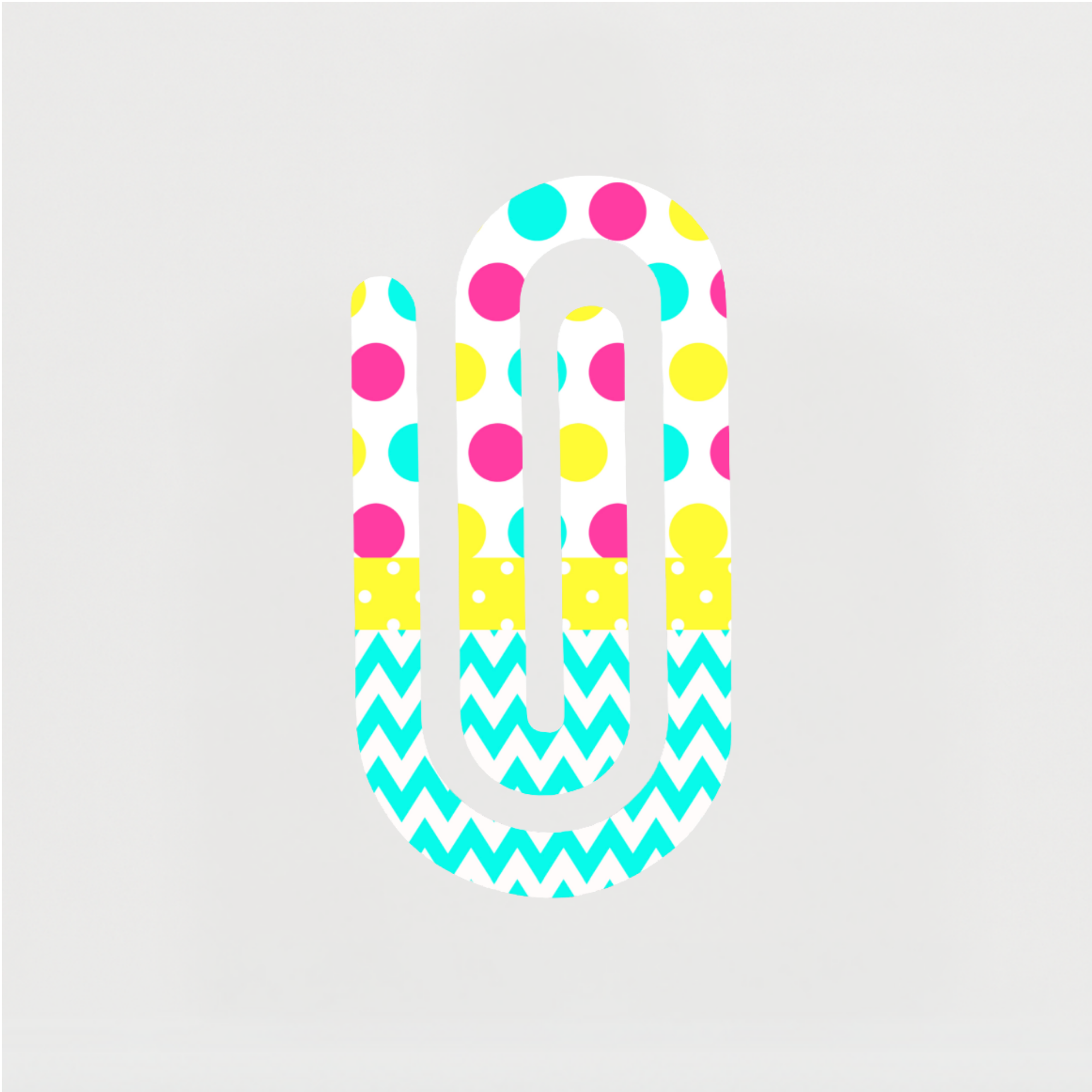 Bright polka dot and chevron jumbo paper clip on white background.