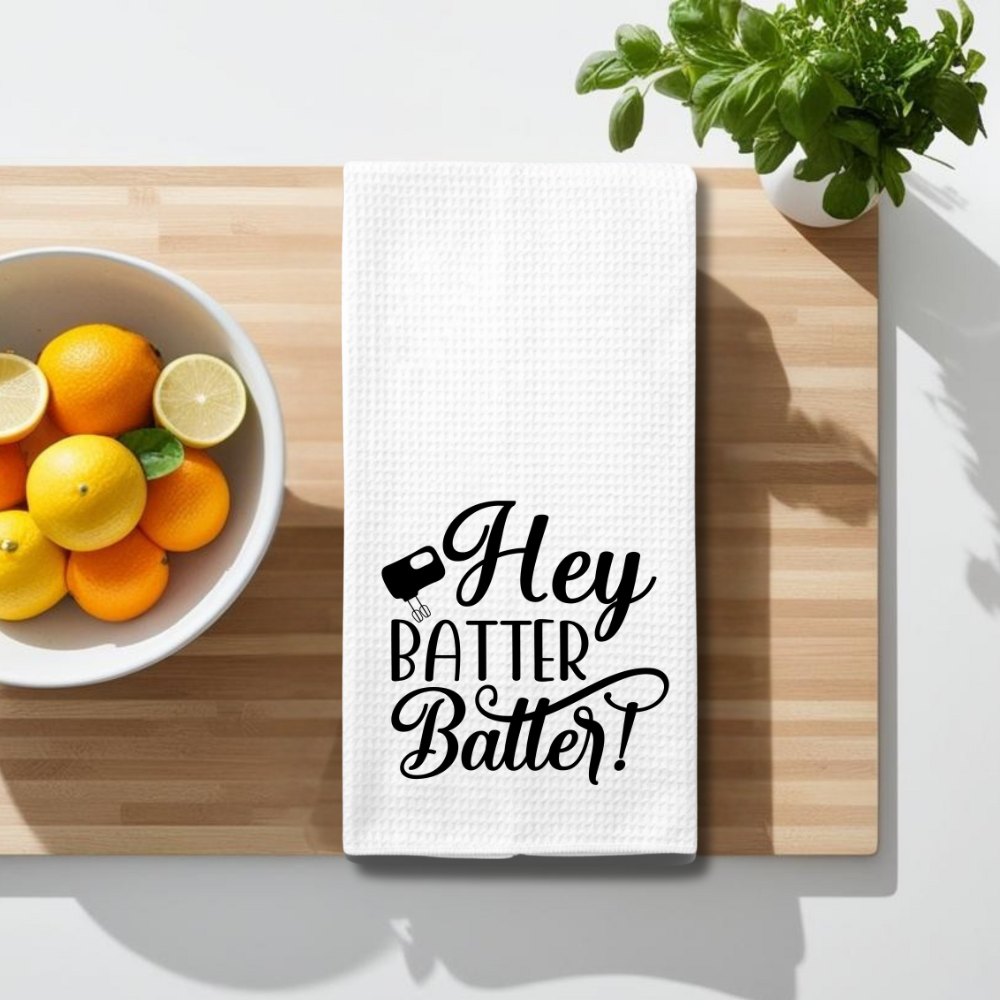 Absorbent and lint-free waffle weave baking towel, styled on a wooden countertop with fresh citrus and herbs.