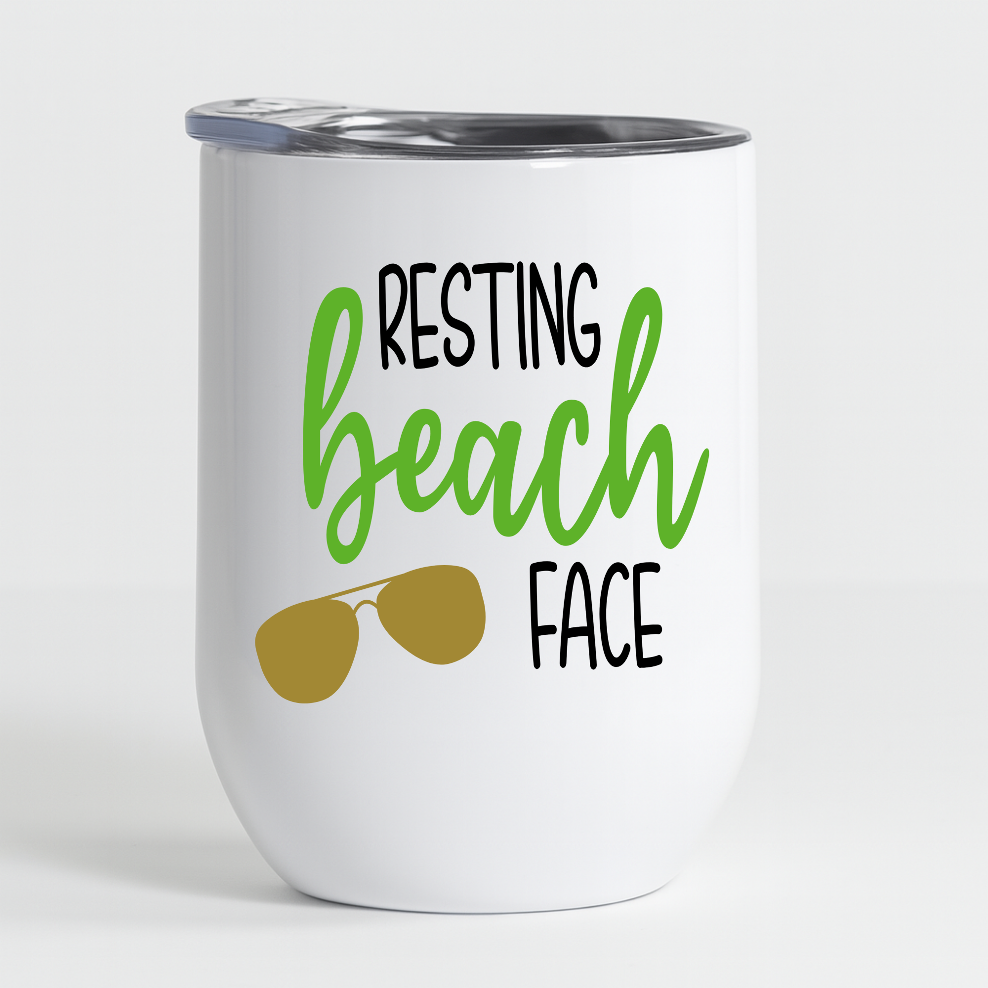 White wine tumbler with “Resting Beach Face” design in green and gold sunglasses graphic on a plain background.