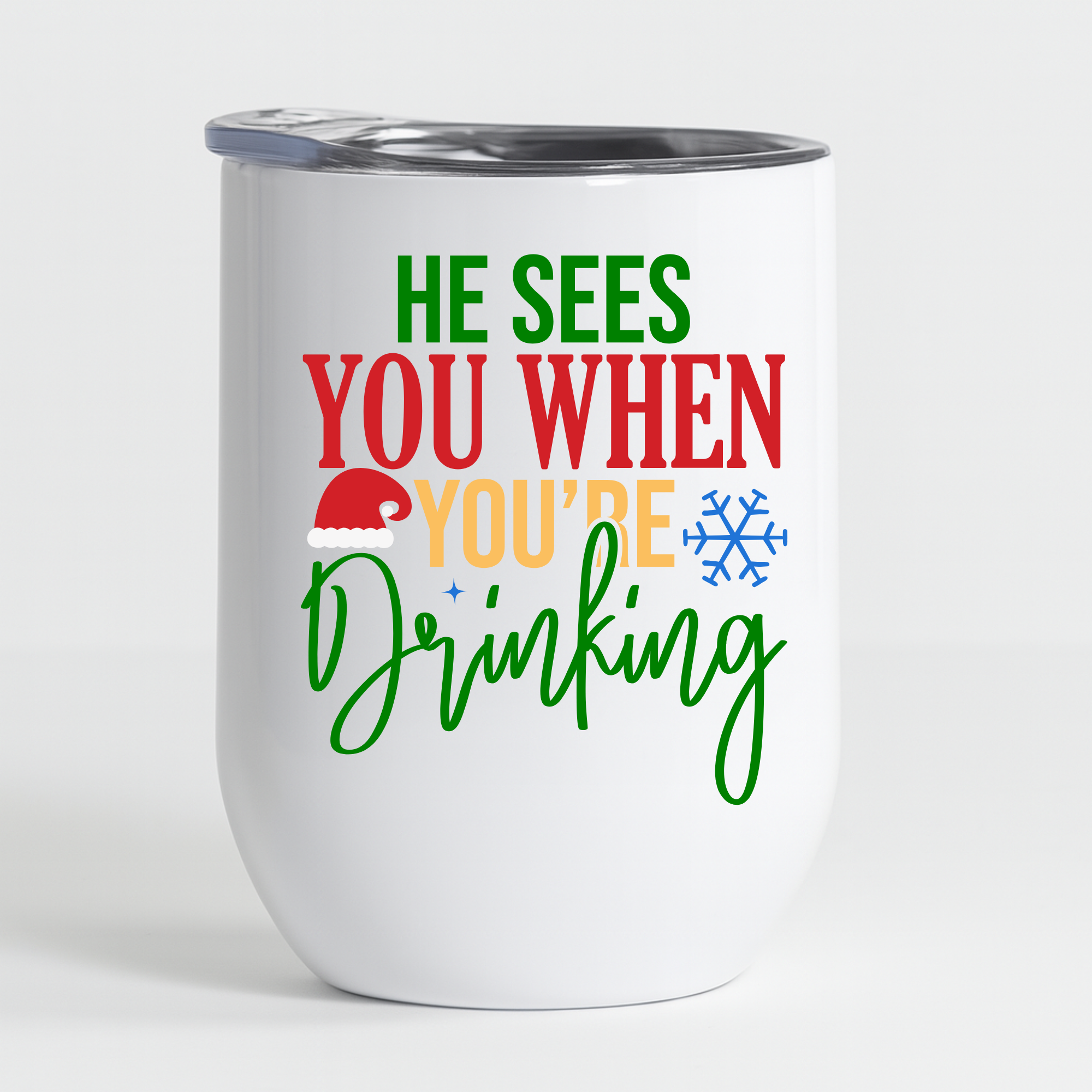 White stainless steel tumbler with the holiday quote “He Sees You When You’re Drinking” shown on a clean, minimal studio background.