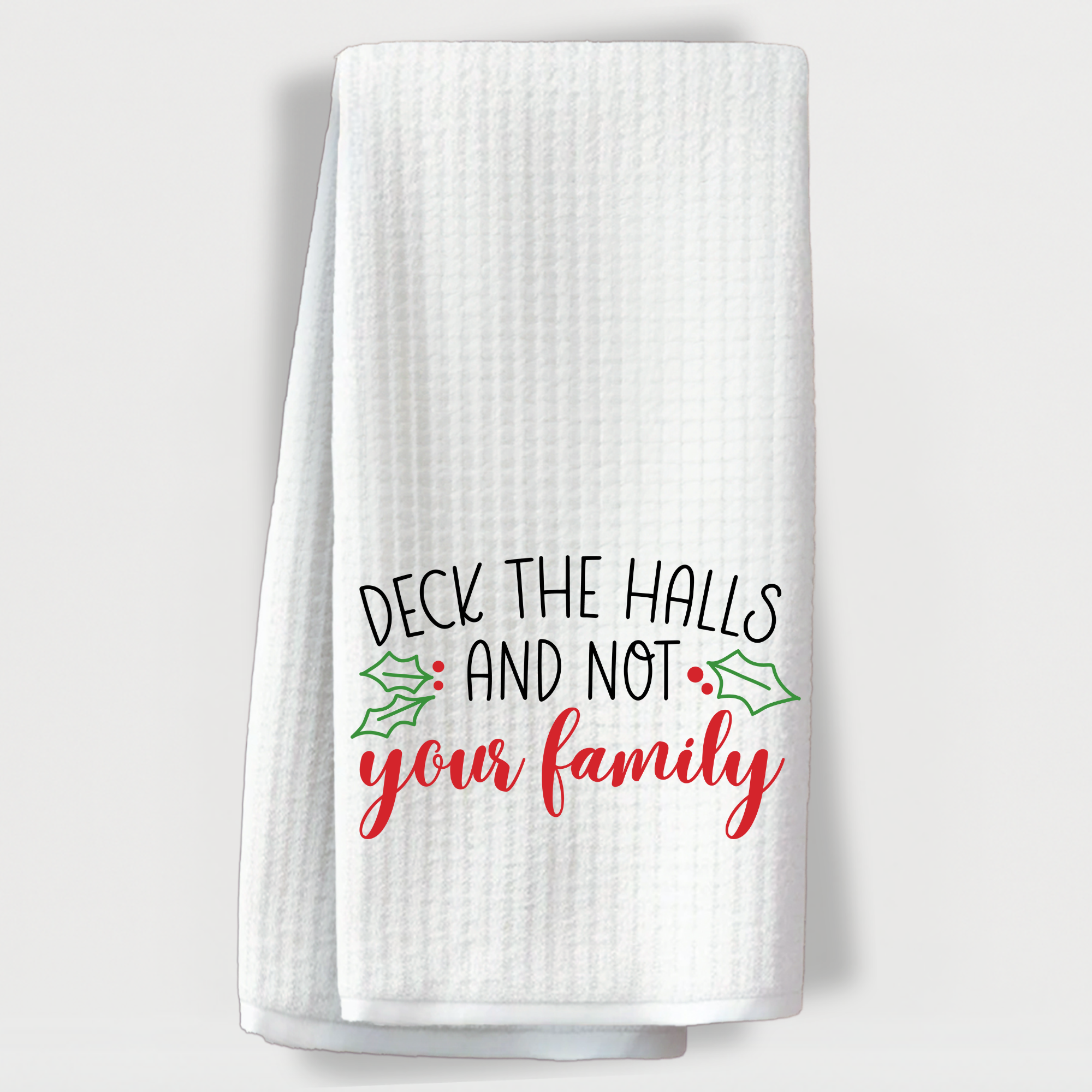 White Christmas towel with funny "Deck the Halls and Not Your Family" holiday saying.