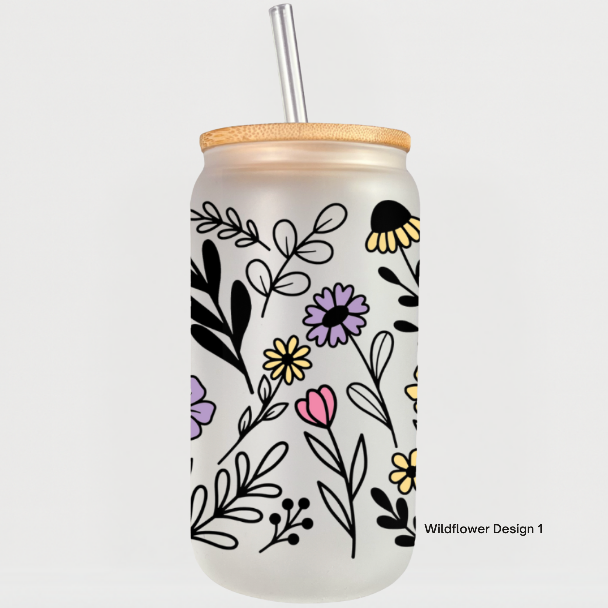 Glass tumbler featuring hand-drawn wildflowers and leaves in black, purple, yellow, and pink.