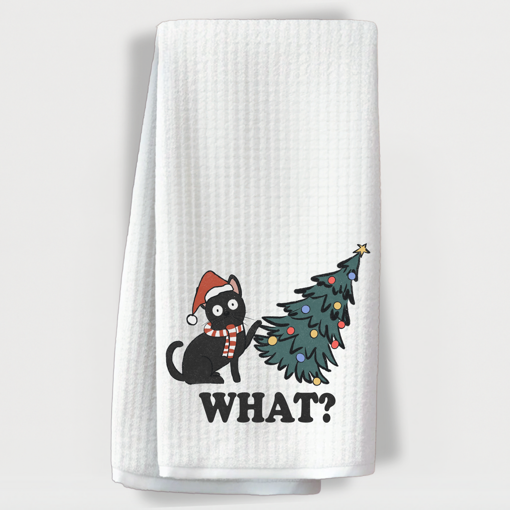 Holiday kitchen towel with mischievous black cat and tree.