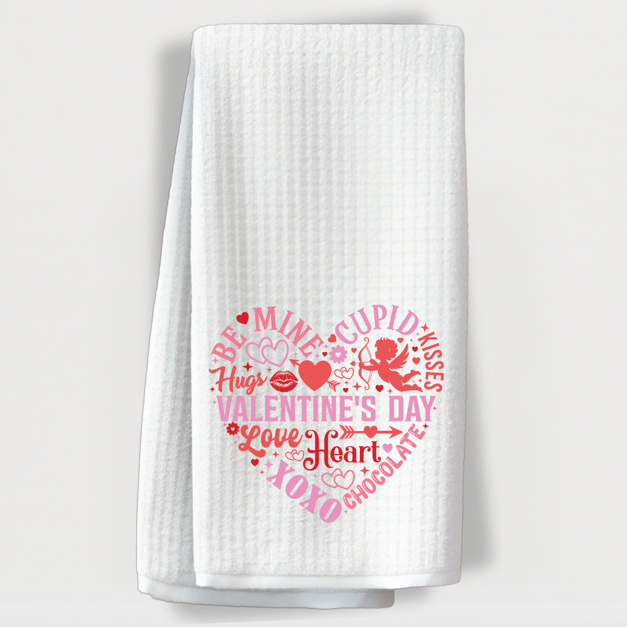 Valentine's Day towel with a heart made of pink and red romantic words, icons, and Cupid.