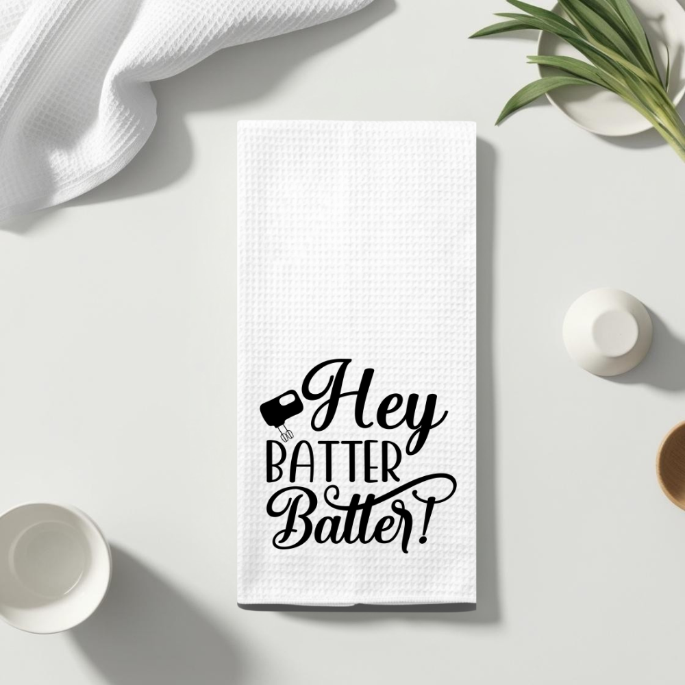 Premium microfiber waffle weave dish towel with humorous baking pun, displayed on a clean, minimalist countertop.